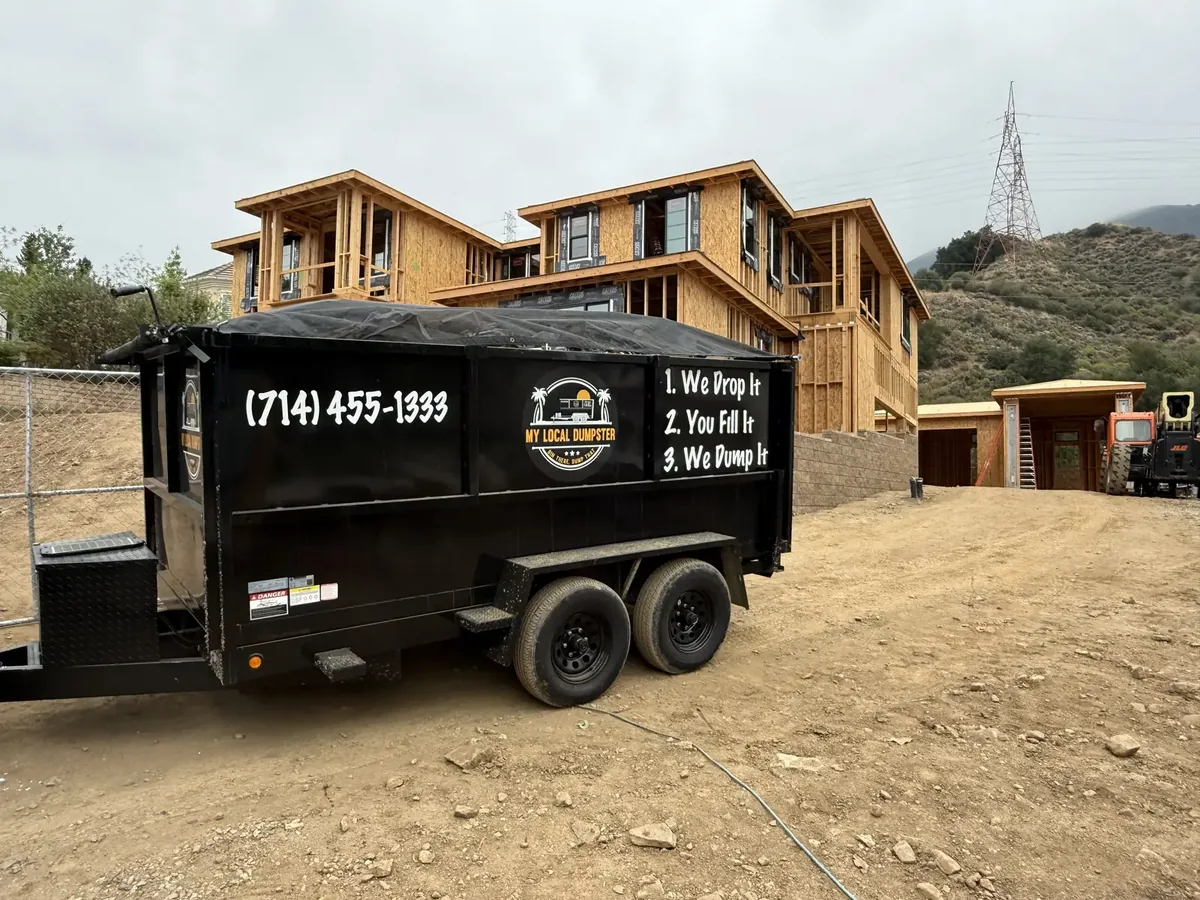 Dumpster placed safely on a residential stamped-concrete driveway without damage