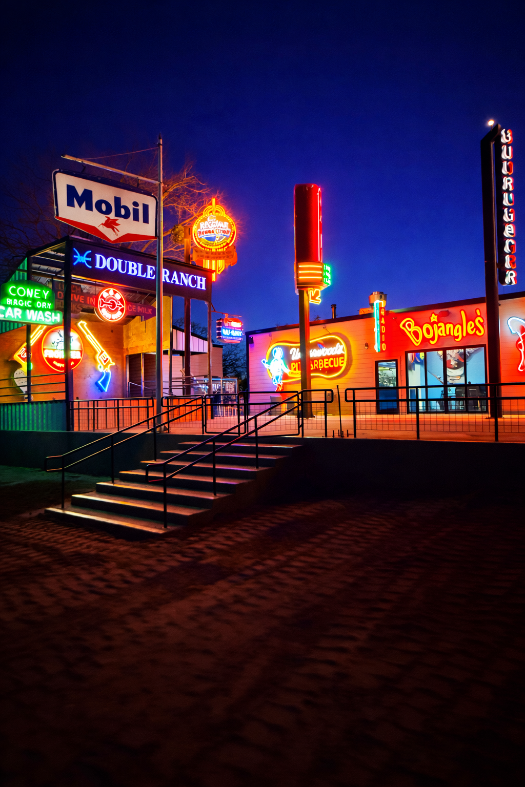 Double E Ranch & Venue illuminated with neon signs and vintage branding, showcasing Texas hospitality