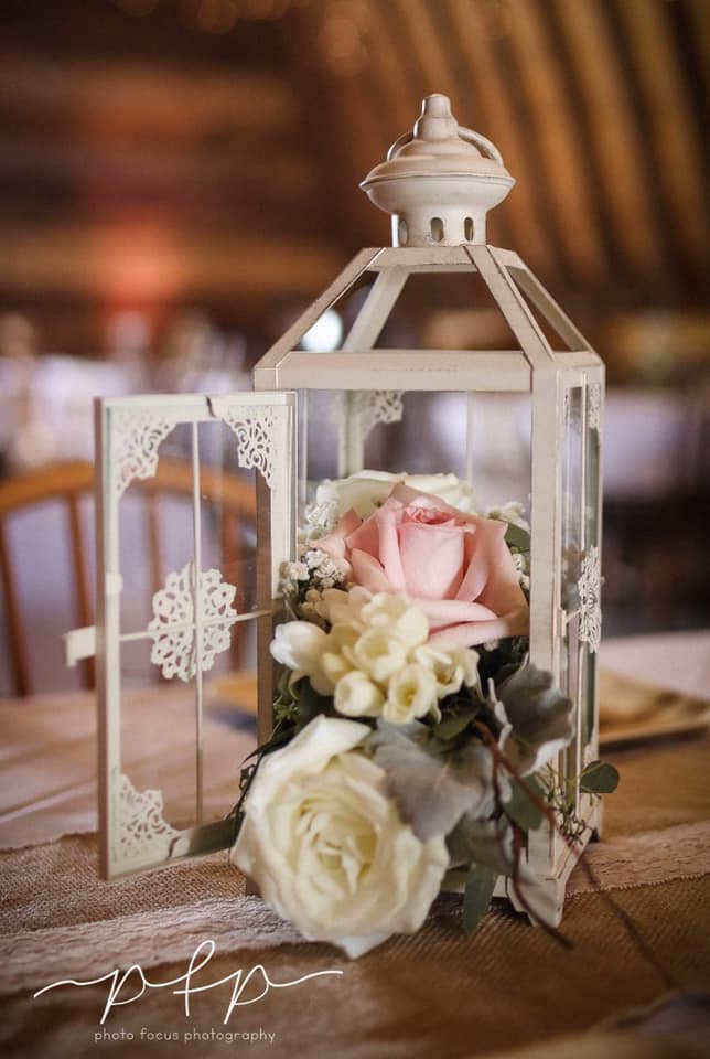Lantern centerpiece with pink rose