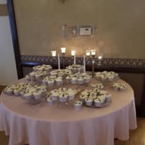 Elegant cupcake display table with candles