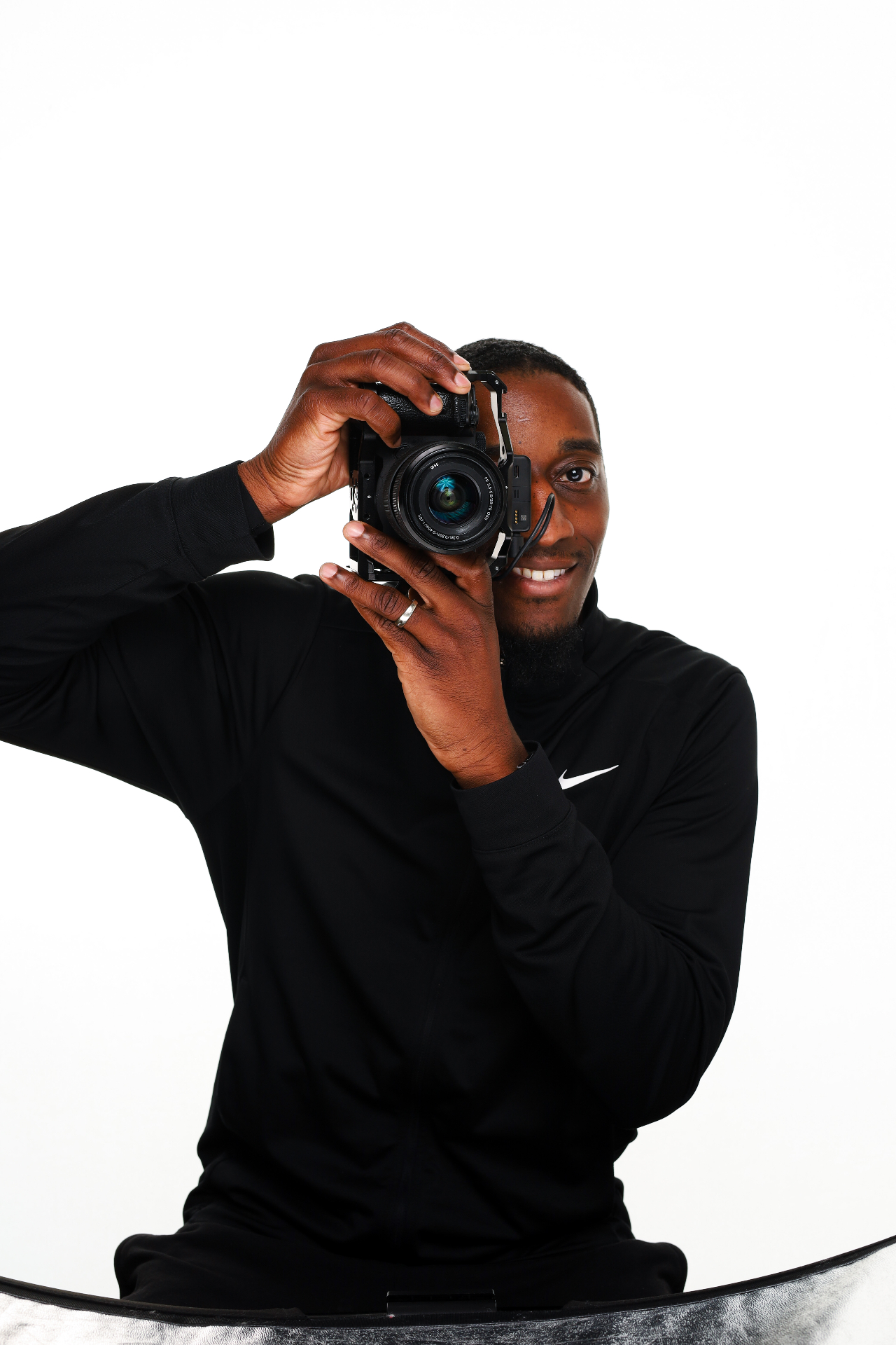 IMN Lightment Productions videographer filming on set