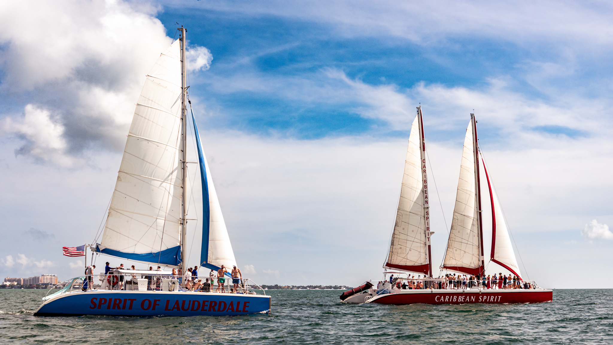 Group of friends enjoying a private event on the catamaran at sunset