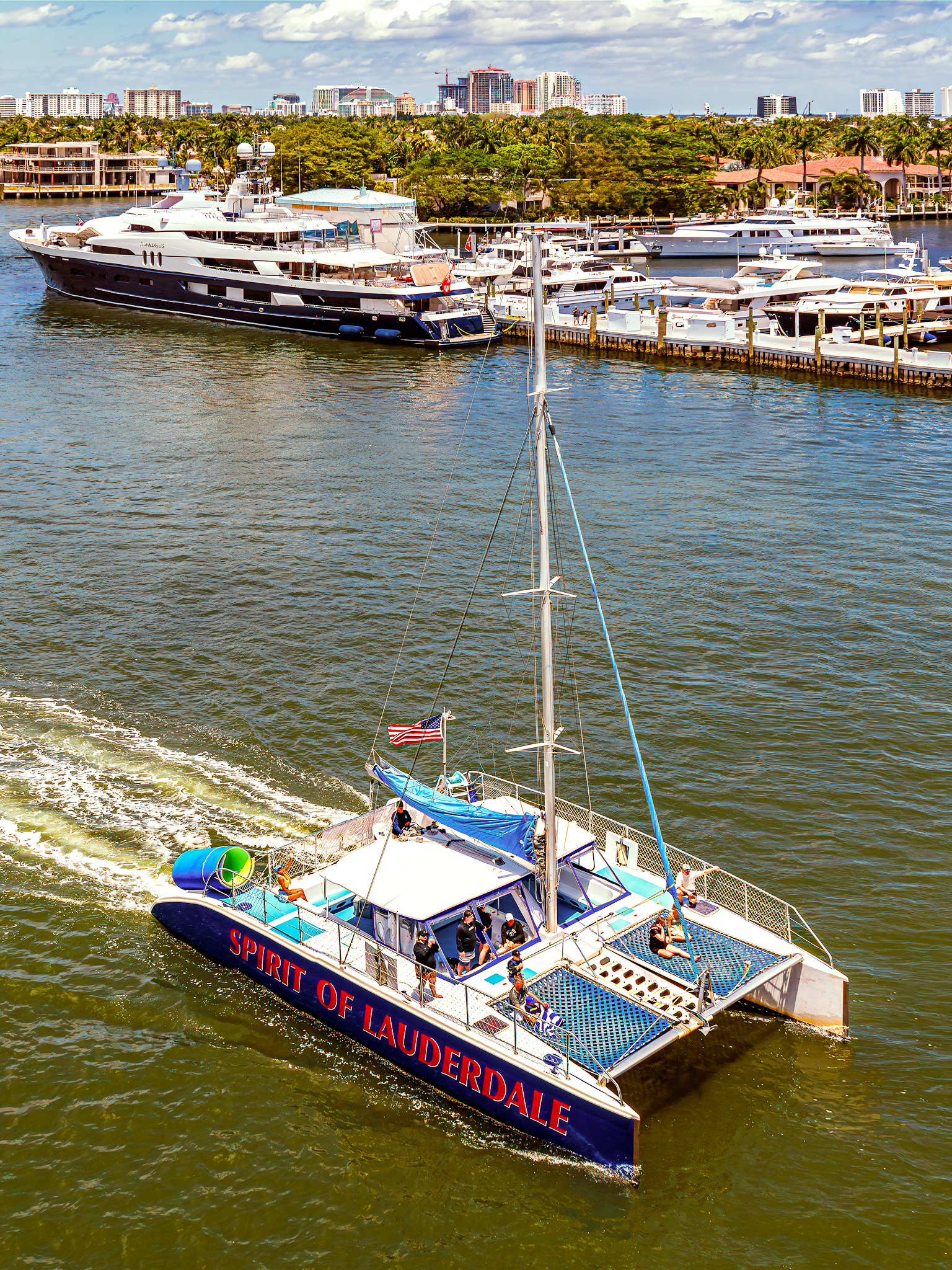 Hero Image: Spirit of Lauderdale catamaran sailing near the Fort Lauderdale coastline with guests enjoying the sun