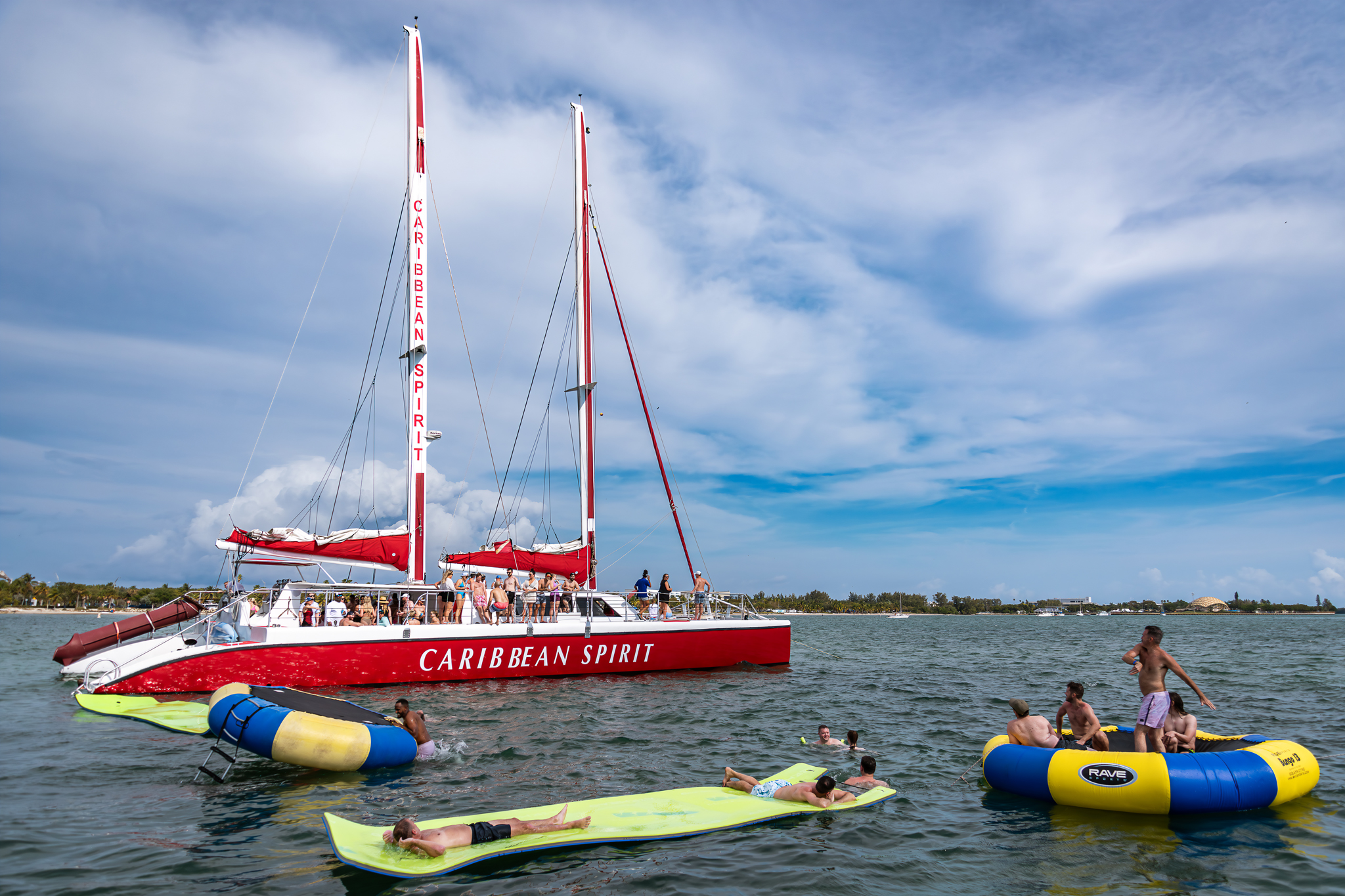 Caribbean Spirit anchored with guests swimming and relaxing on floaties