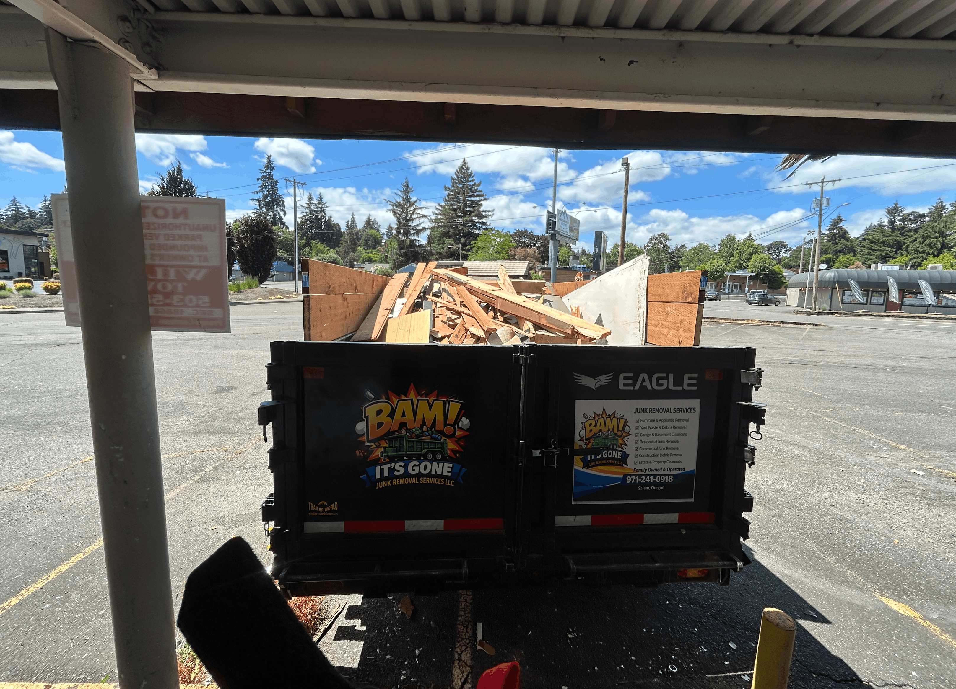 BAM It's Gone Junk Removal trailer full of debris