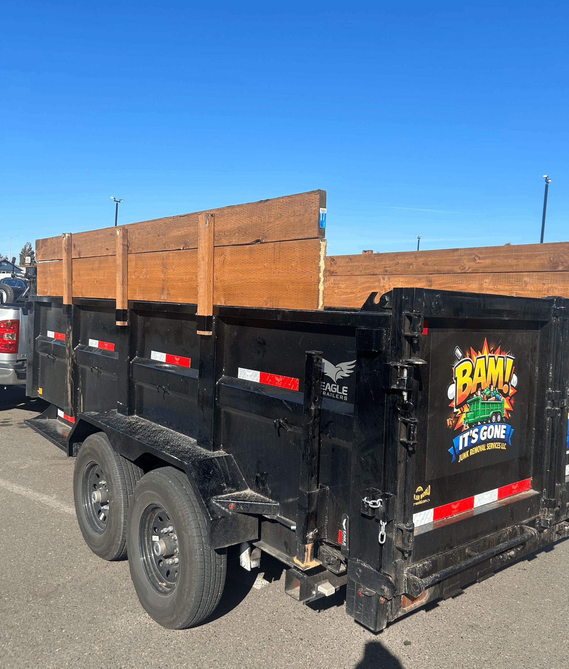 BAM It's Gone Junk Removal trailer with wood extensions