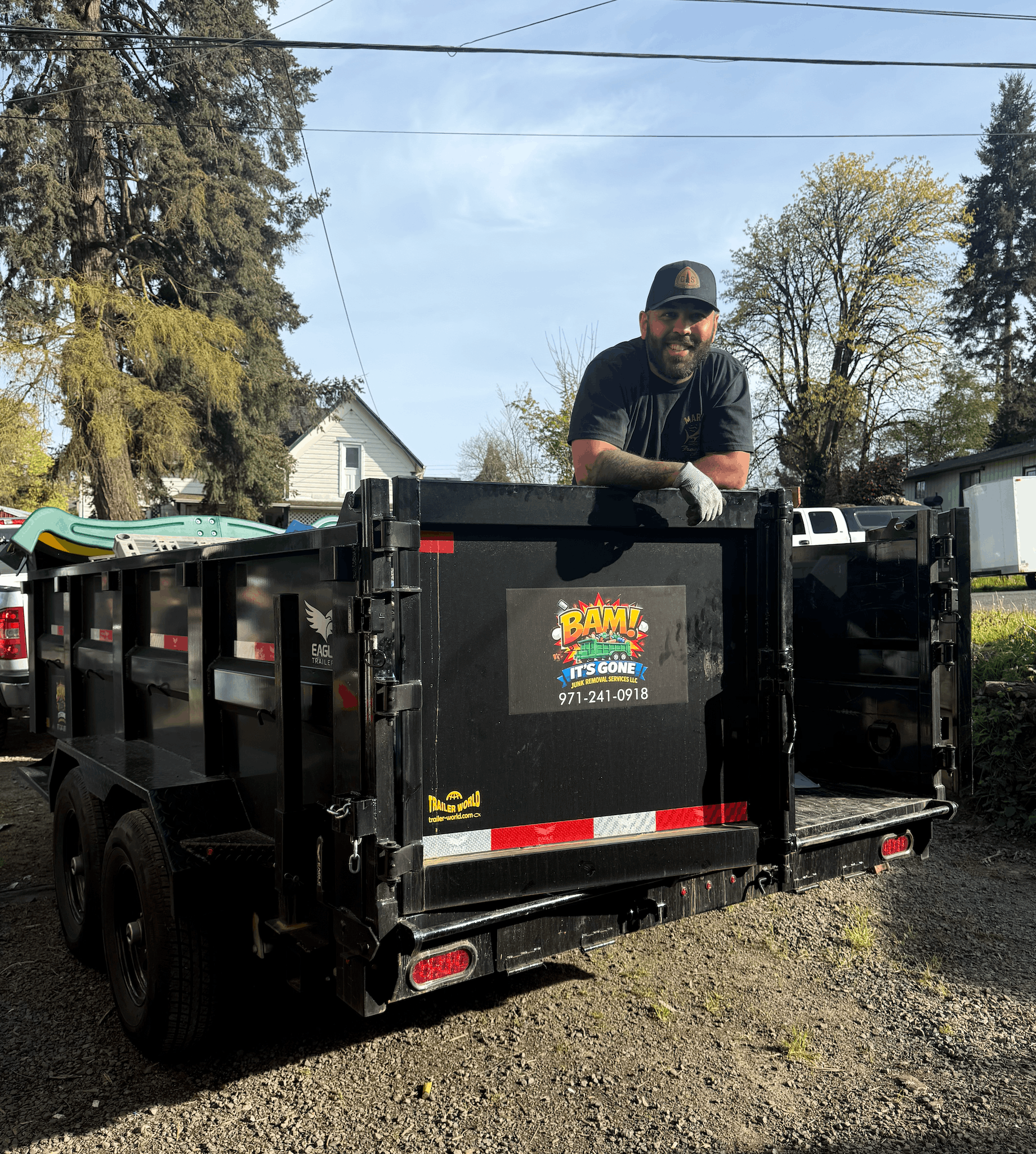 Brandon with the BAM It's Gone junk removal truck and trailer