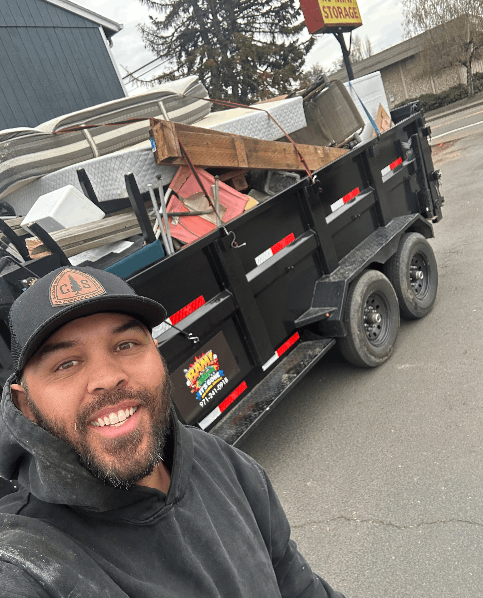 Side view of a full junk removal trailer in Salem OR