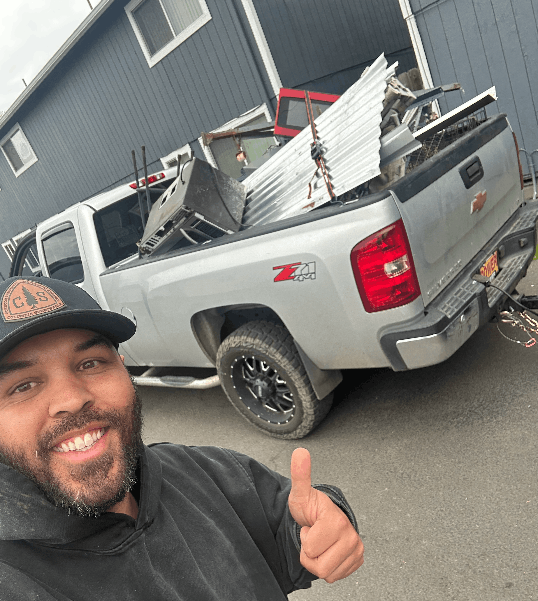 Brandon with a truck full of metal and junk for removal