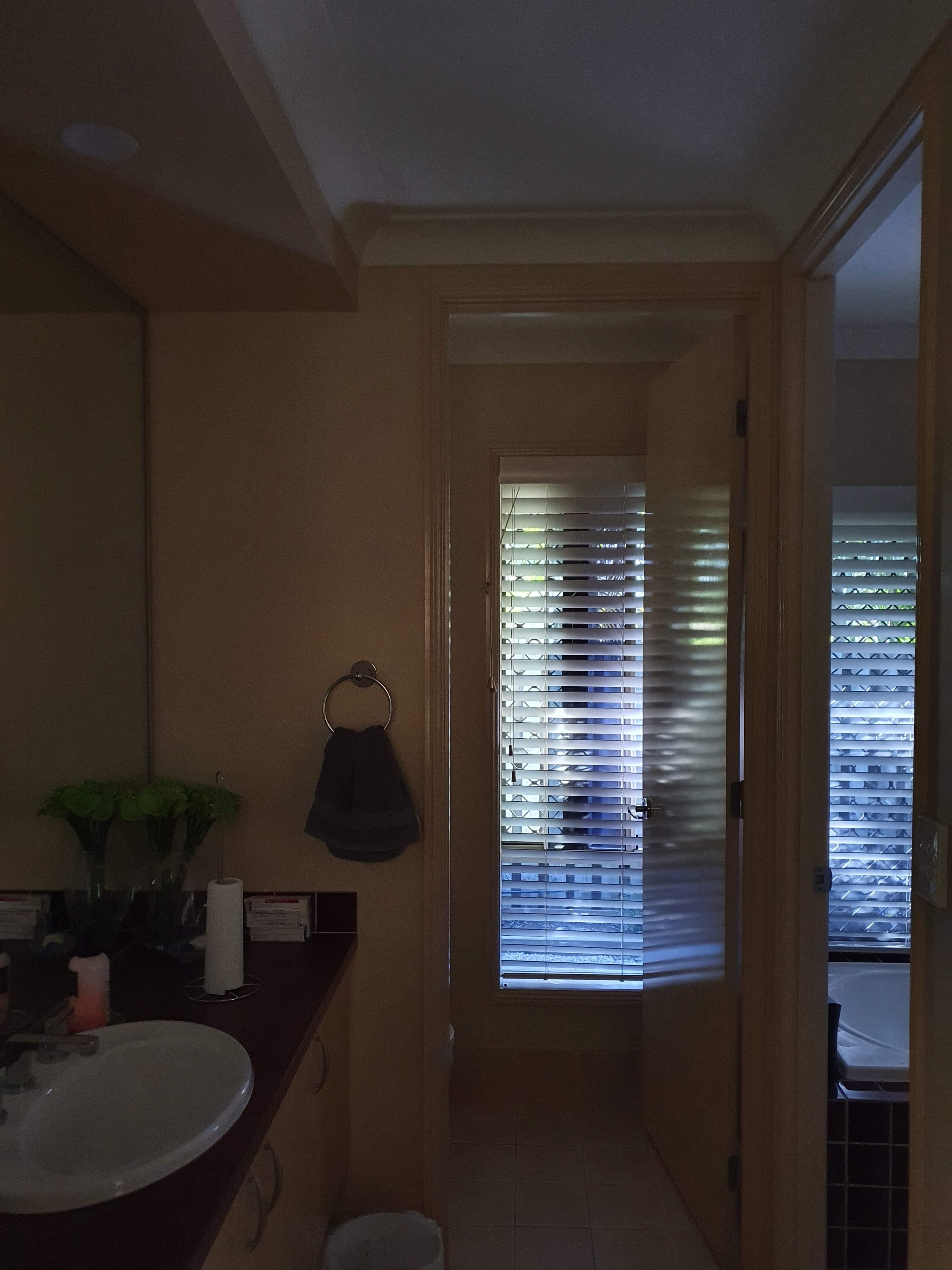 Dark bathroom vanity before Redilight