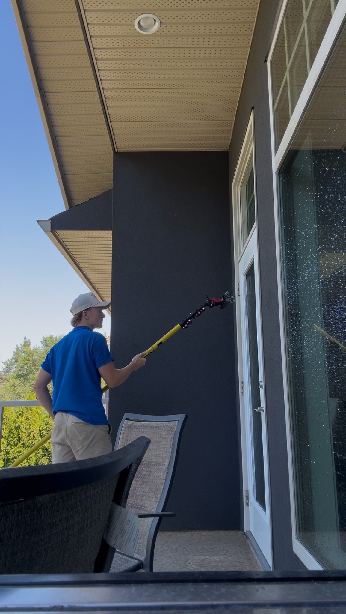 Chilko team member cleaning windows
