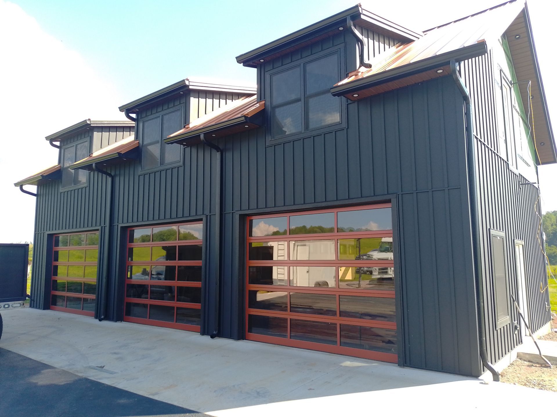 Completed exterior siding, gutter, and roofing project by Square One Gutters & Roofing
