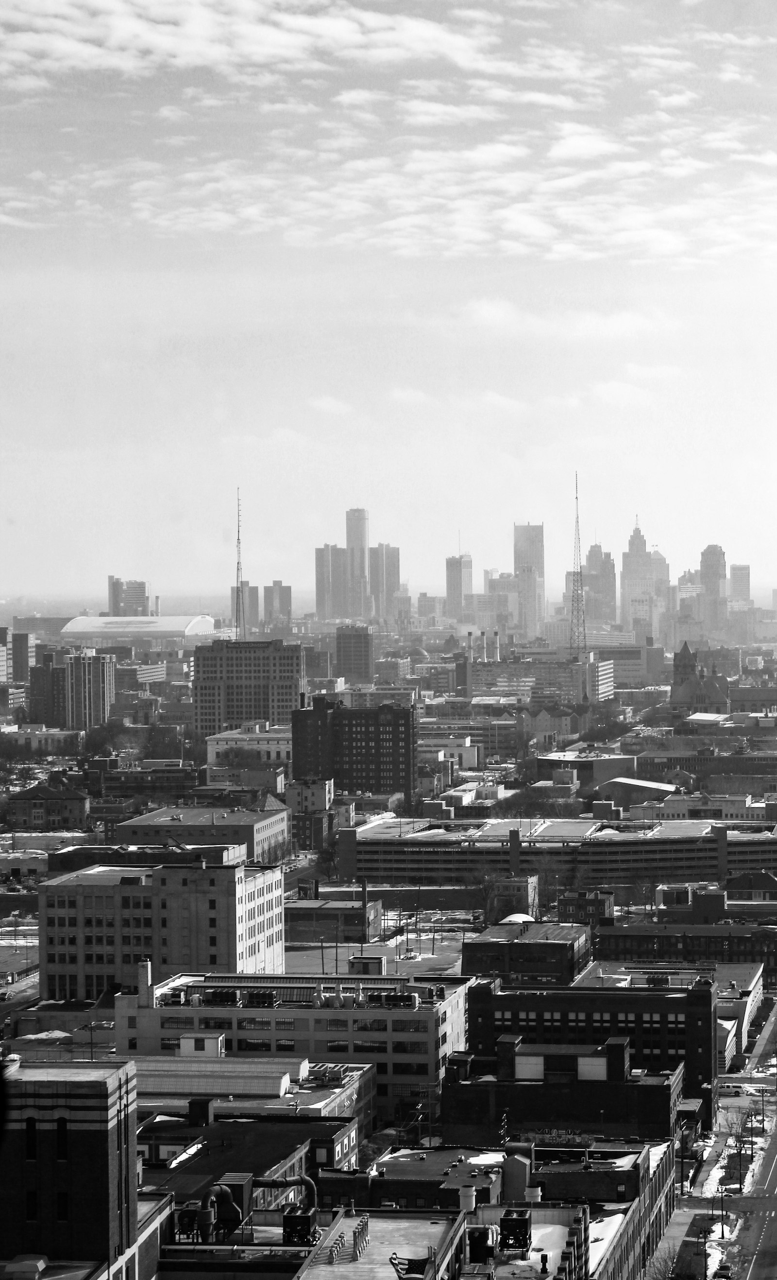 Grayscale photo of Detroit city buildings and skyline