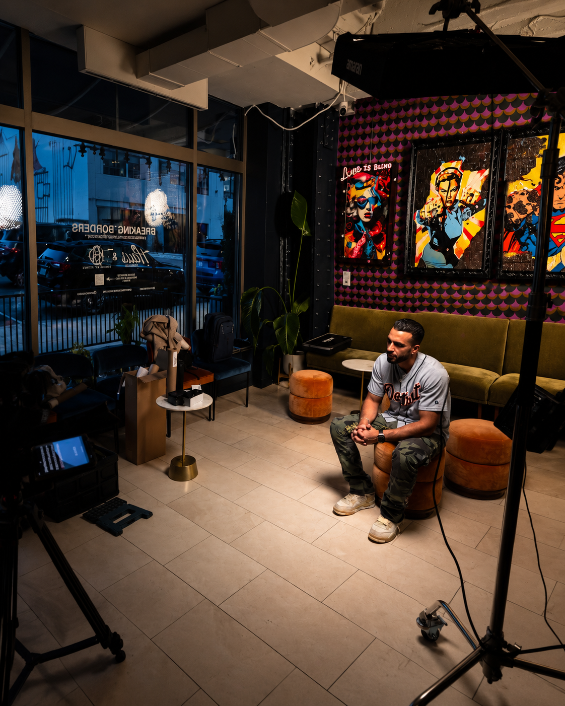 Figure 1.1 — Mohamad Fardous interviewed on set surrounded by original Karma by Design canvas artwork in his creative studio space.