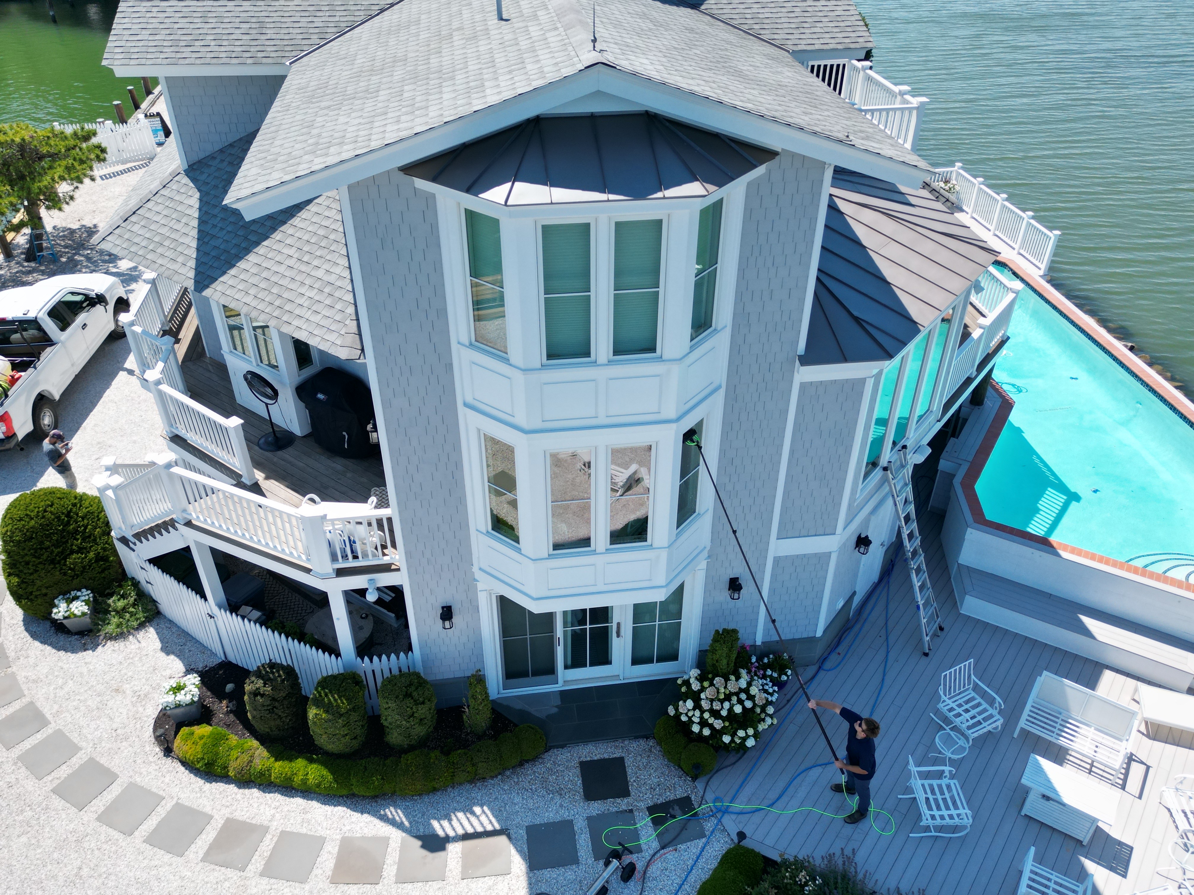 Coastal Shine cleaning the windows of a waterfront home on Maryland's Eastern Shore