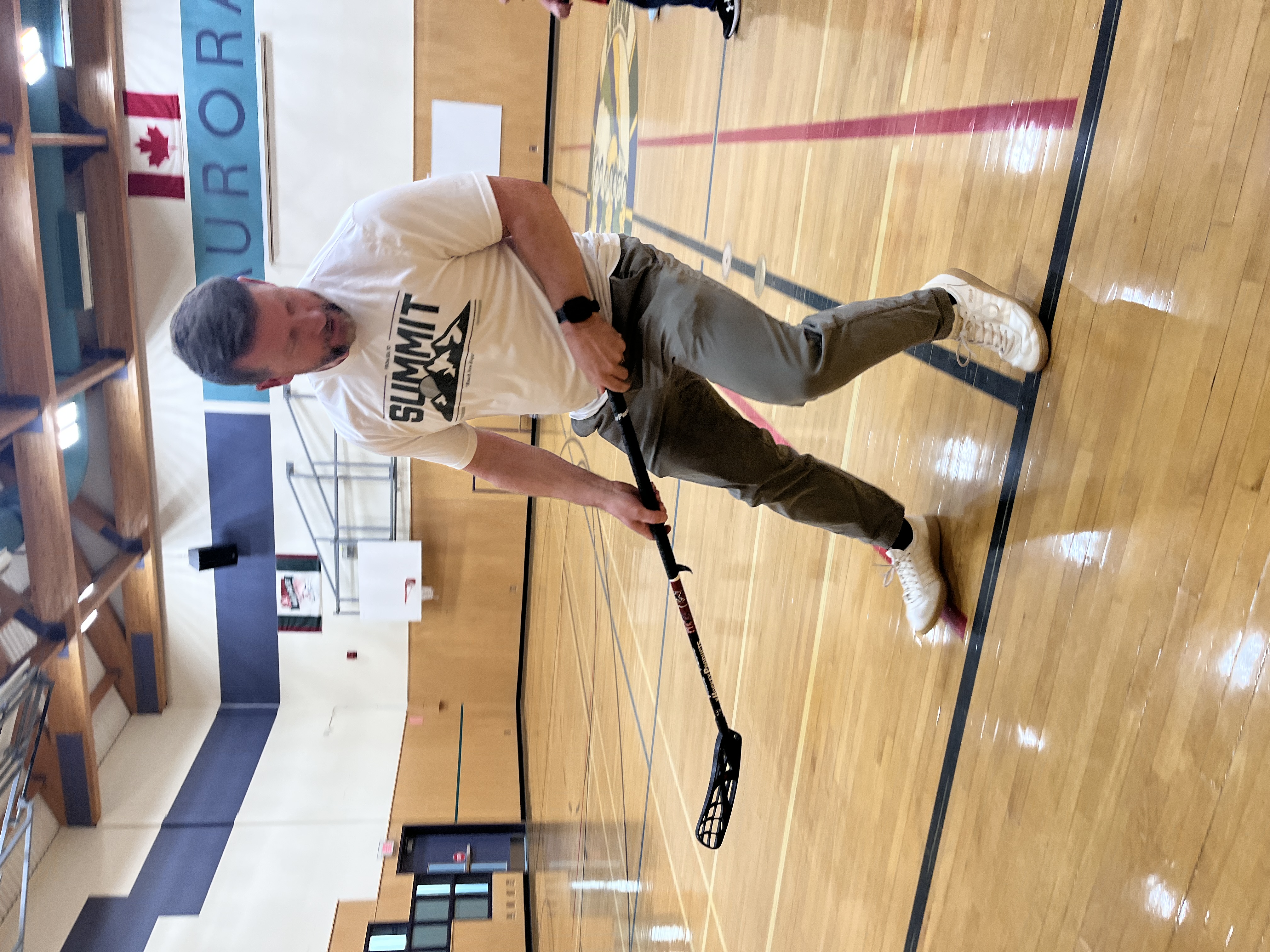 Coach Larry Moberg coaching floorball