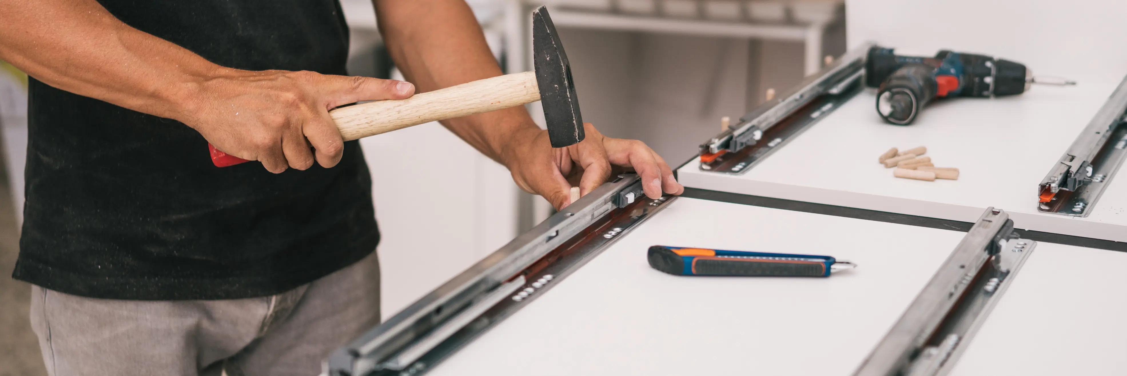 Technician assembling furniture with tools