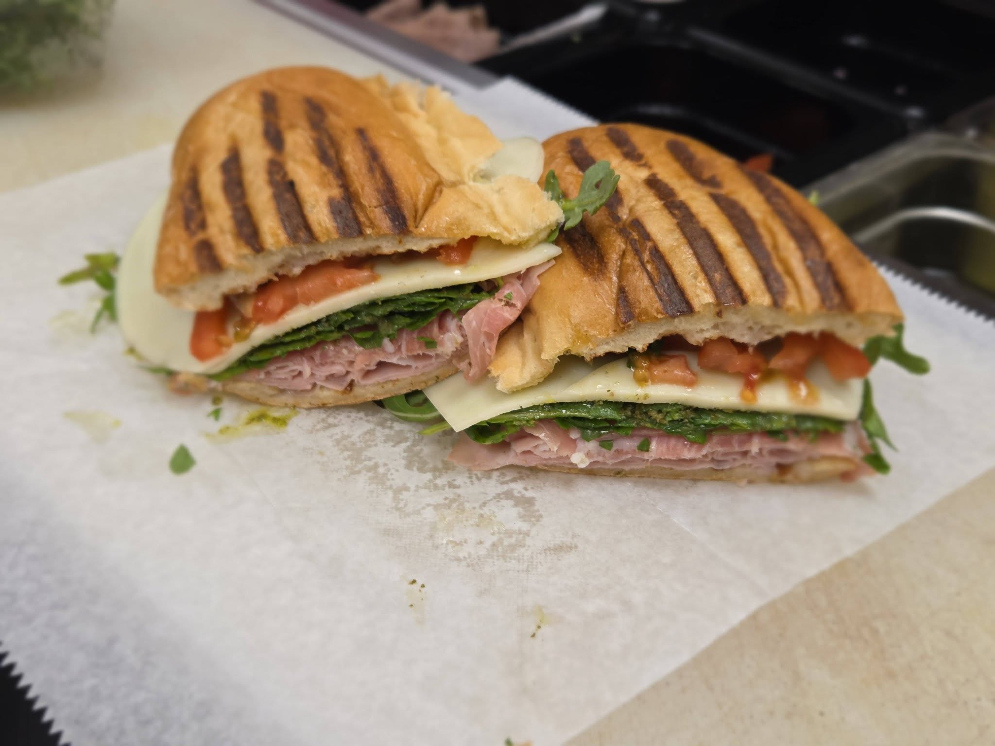 Panini sandwich on white paper