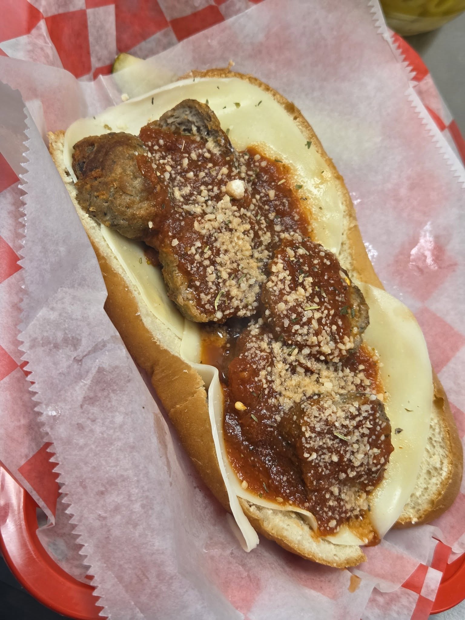 Meatball sub with cheese and marinara