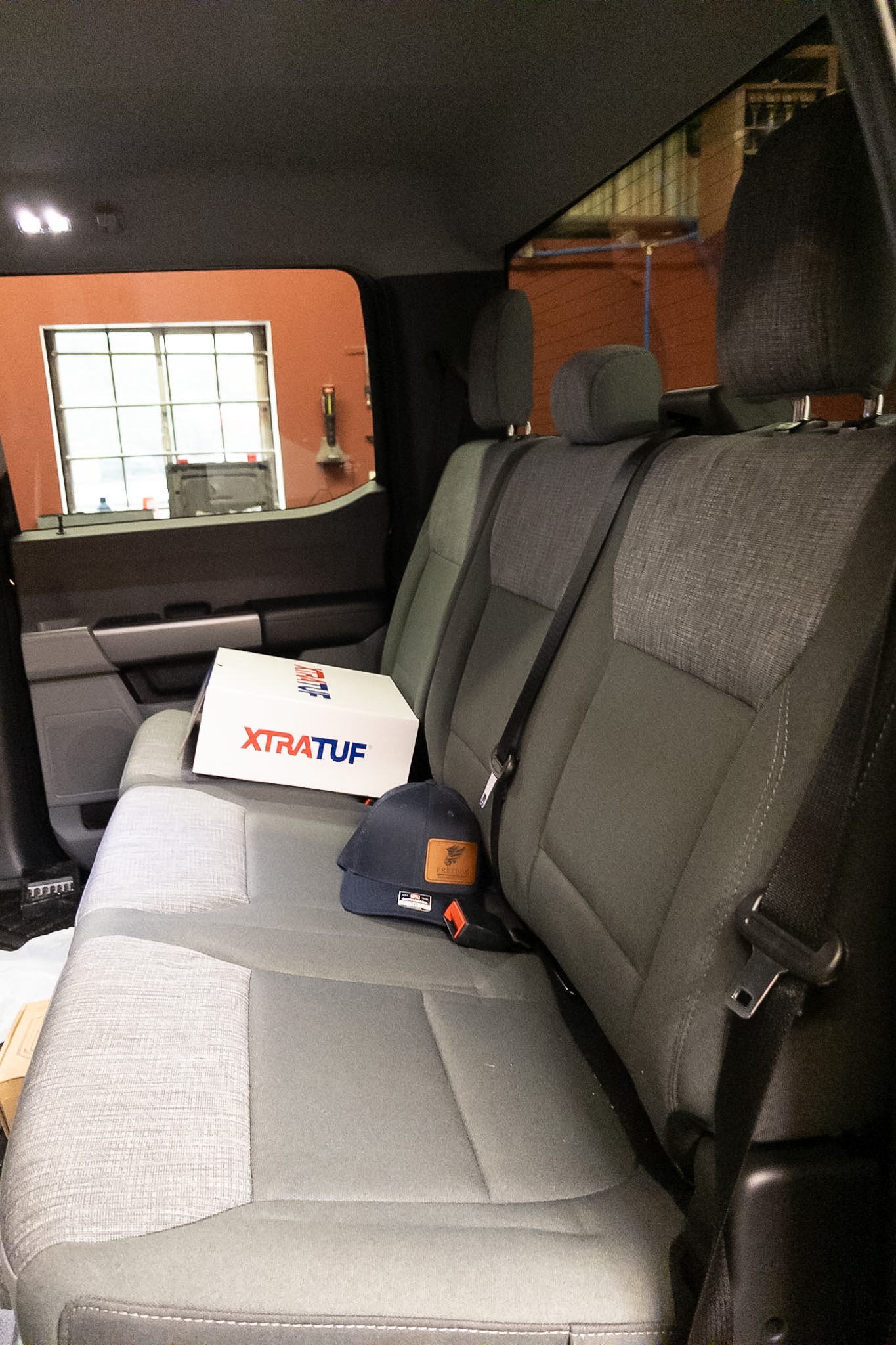 Factory cloth rear seats before Katzkin