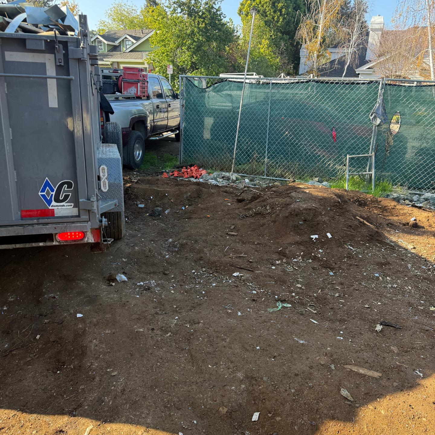 After junk removal: clean new-build site with debris removed
