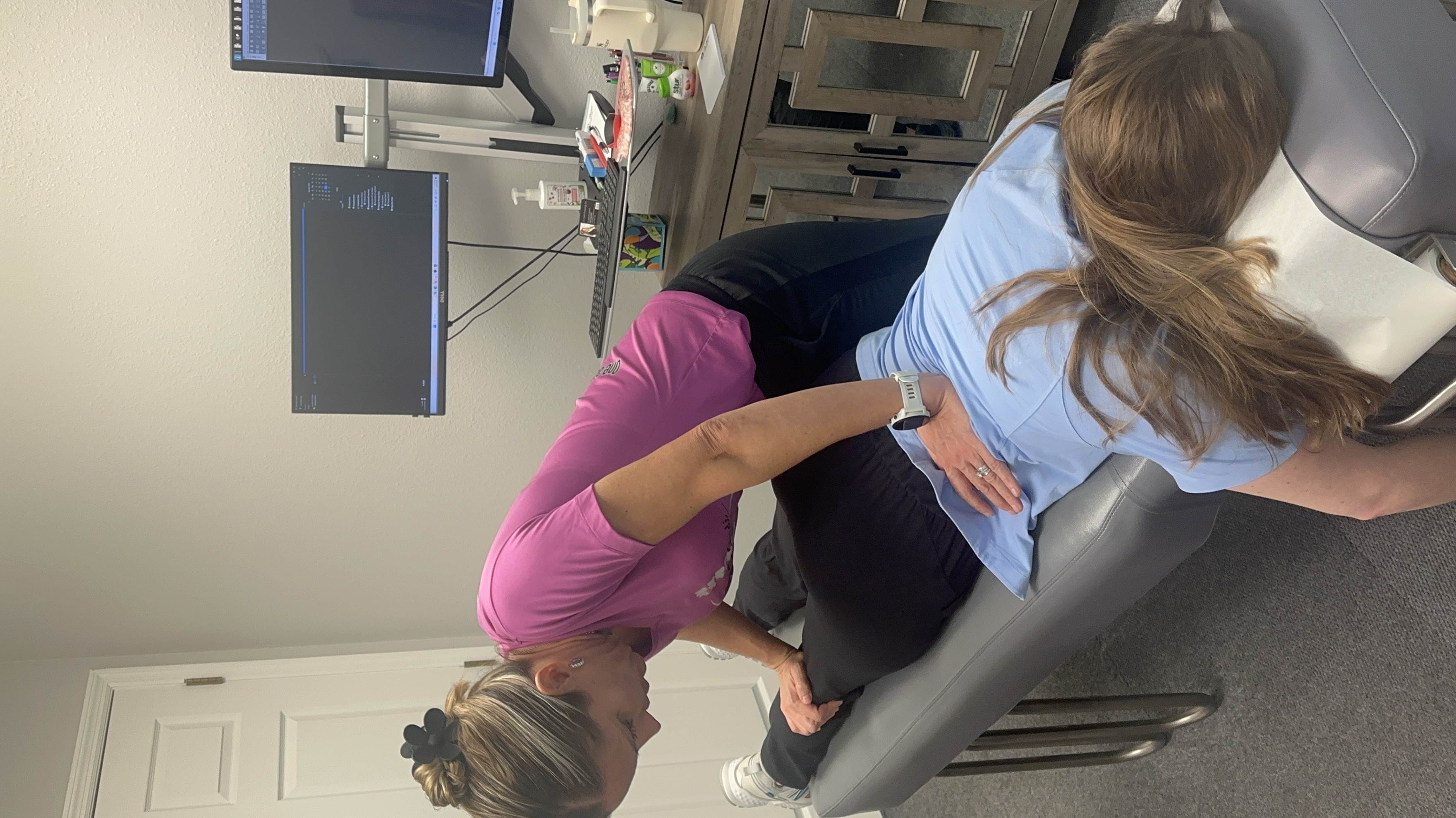 Dr. Heidi performing chiropractic neck adjustment in Lutz FL