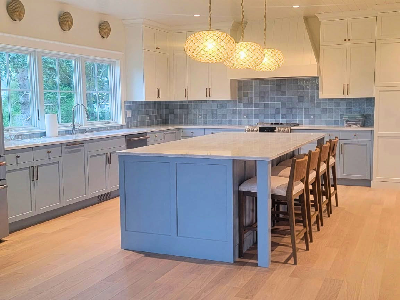 Two-tone kitchen cabinet painting with blue island in NH Seacoast by Minute Men Painters