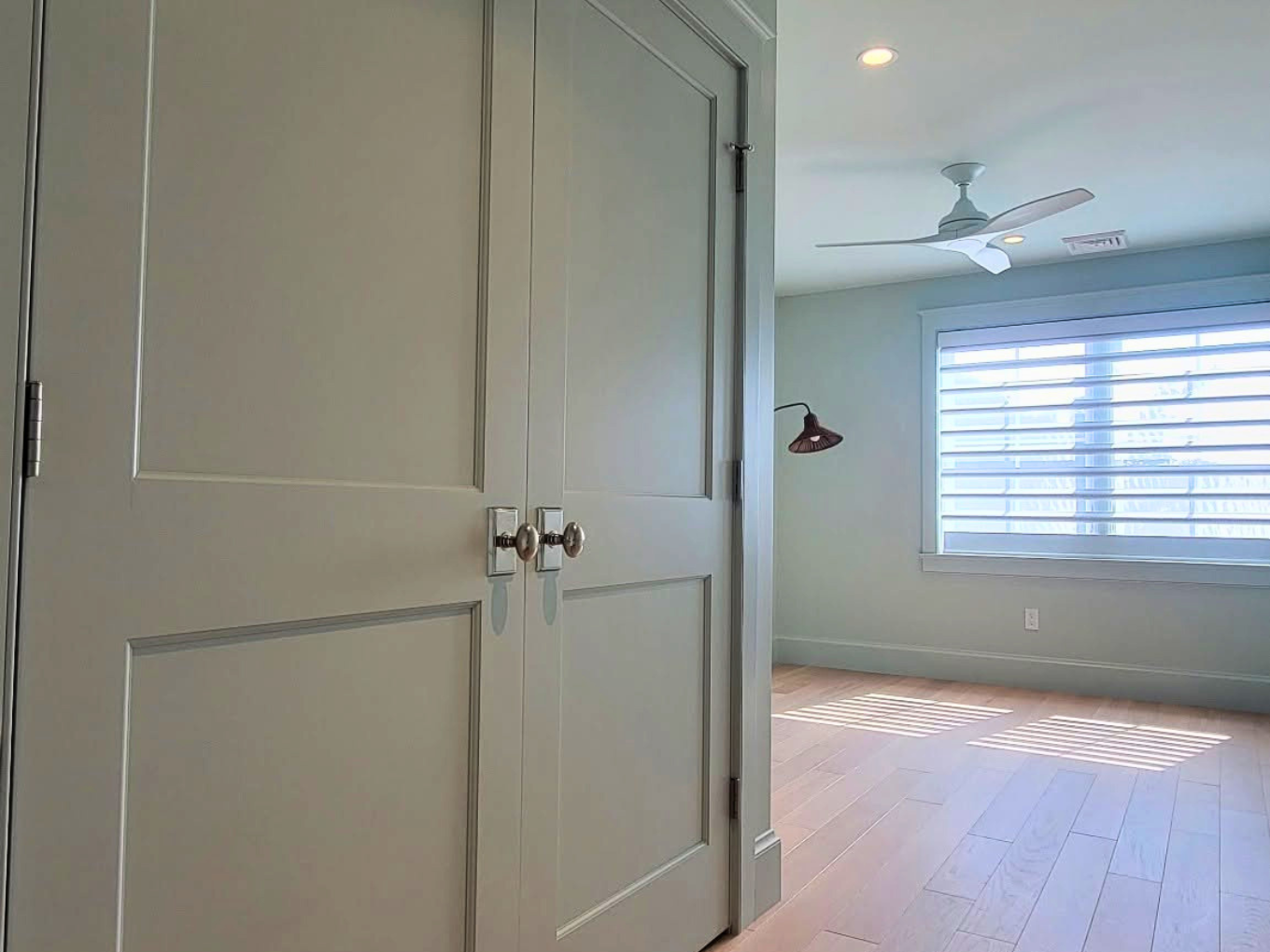 Sage bedroom interior painting with white doors and trim in NH Seacoast by Minute Men Painters
