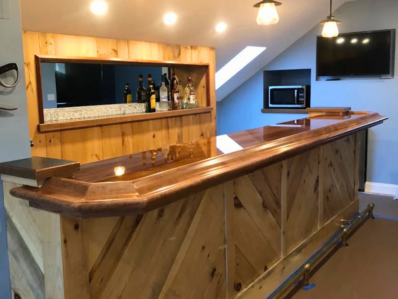 Custom wood finishing and staining on a home bar by Minute Men Painters