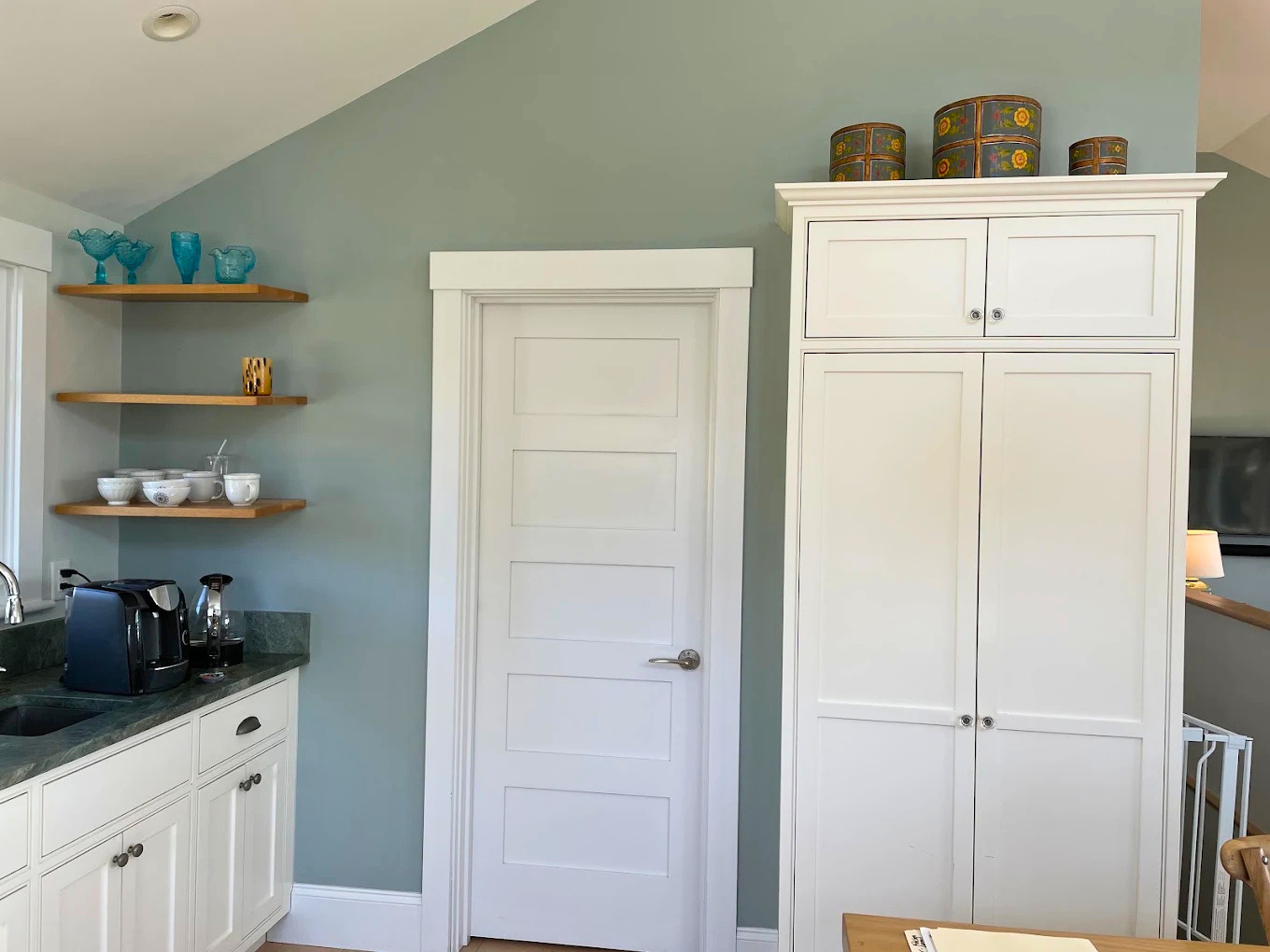 Custom built-in cabinetry refinishing with contrasting island finish by Minute Men Painters