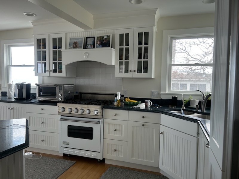 Kitchen cabinet refinishing with a smooth white finish by Minute Men Painters