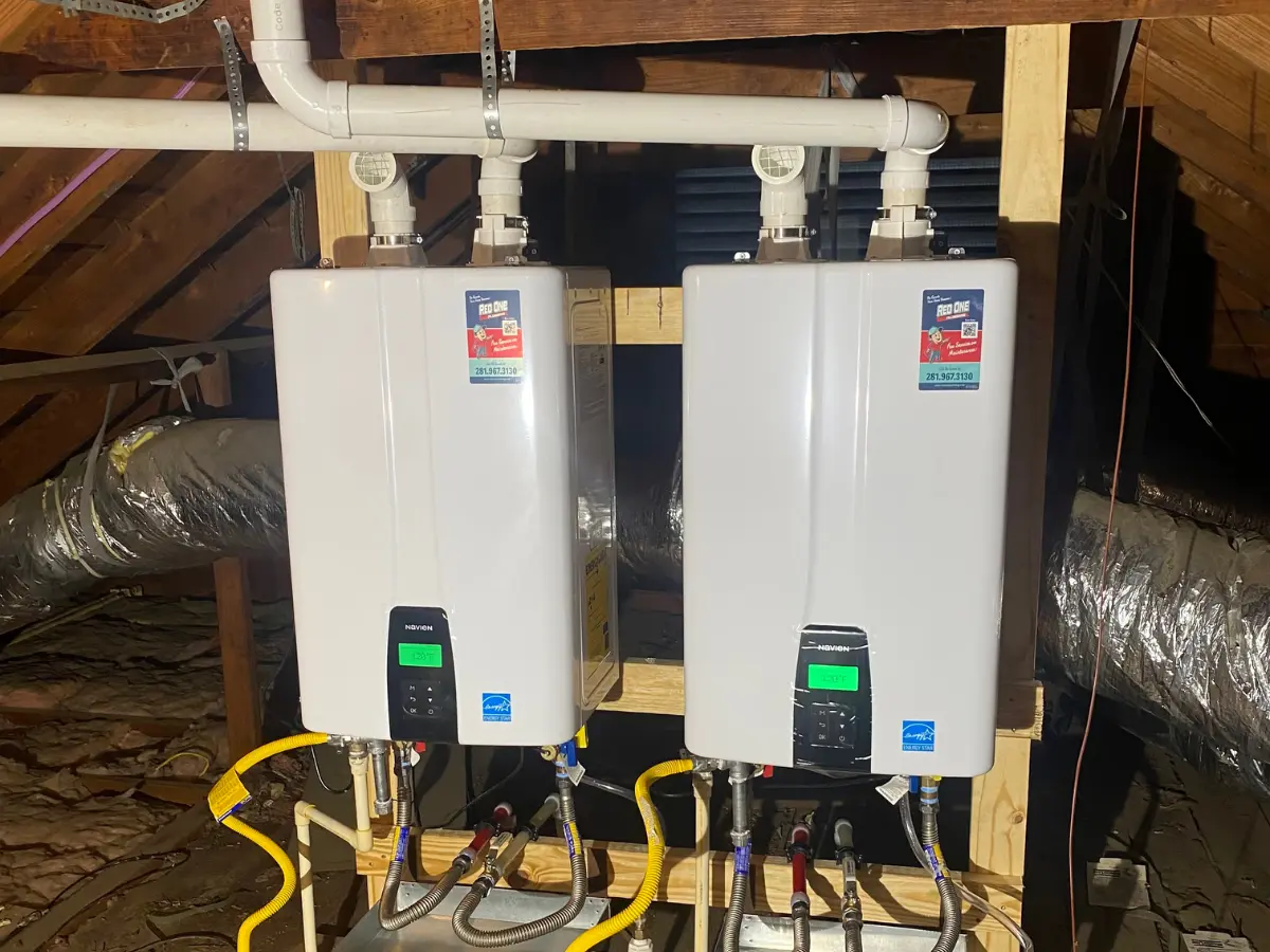 Dual Navien tankless water heater installation in attic by Red One Plumbing in Pearland TX