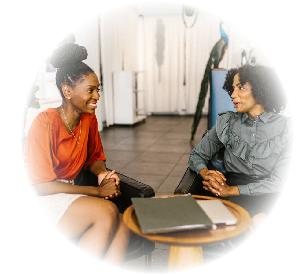 Two women engaging in a deep coaching conversation