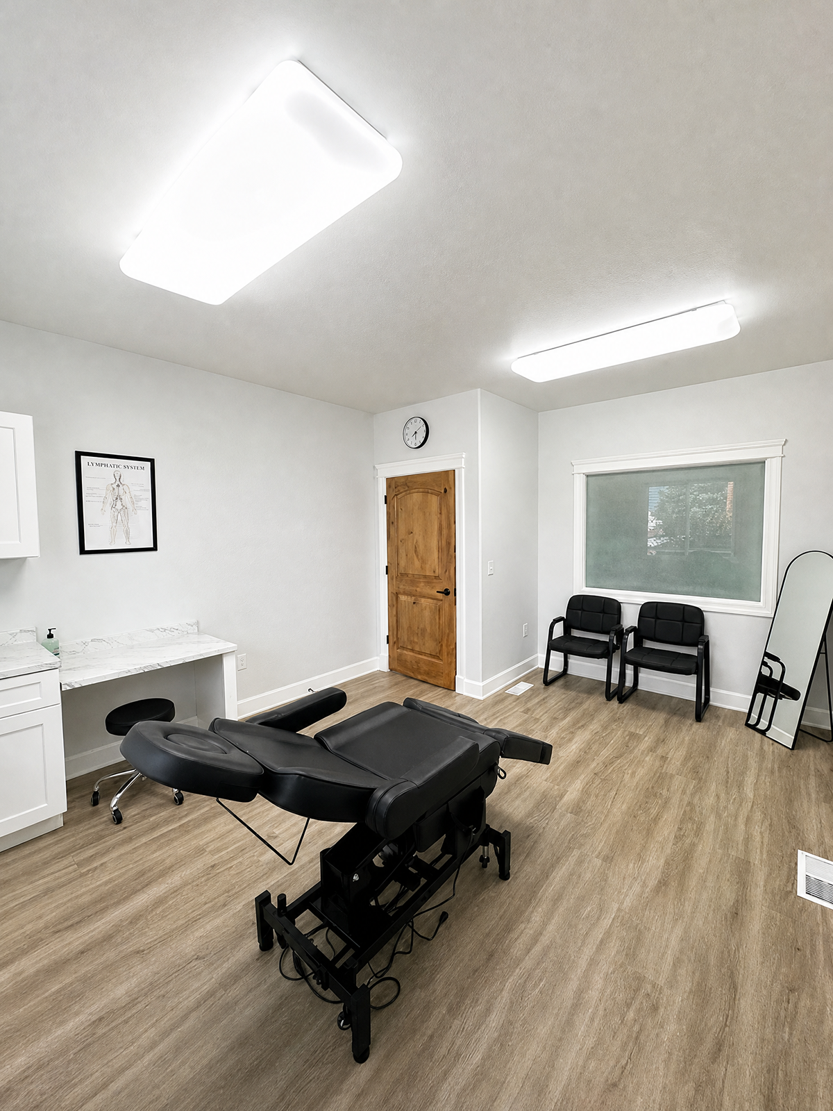 Private lymphedema therapy consultation room with adjustable treatment table in Utah