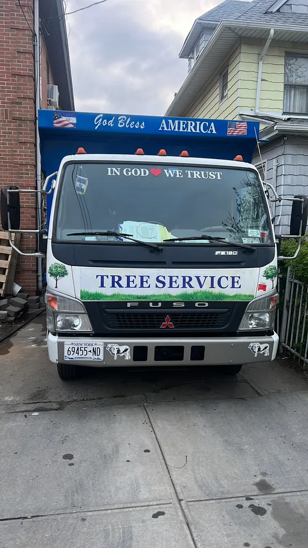 Fully equipped Moreno Landscaping service truck and equipment trailer ready for work
