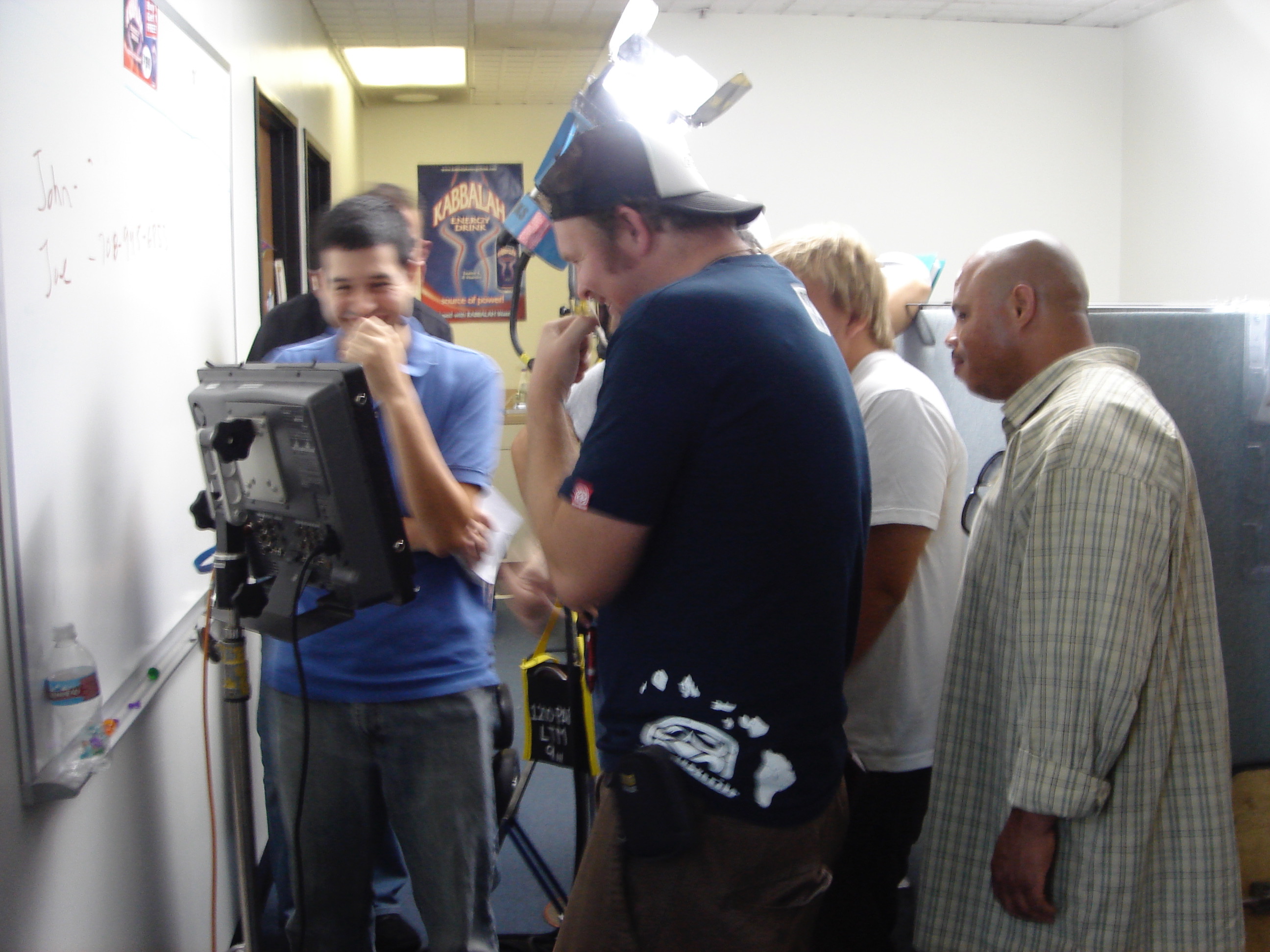 Director reviewing footage on a video monitor during a Rhode Island commercial shoot