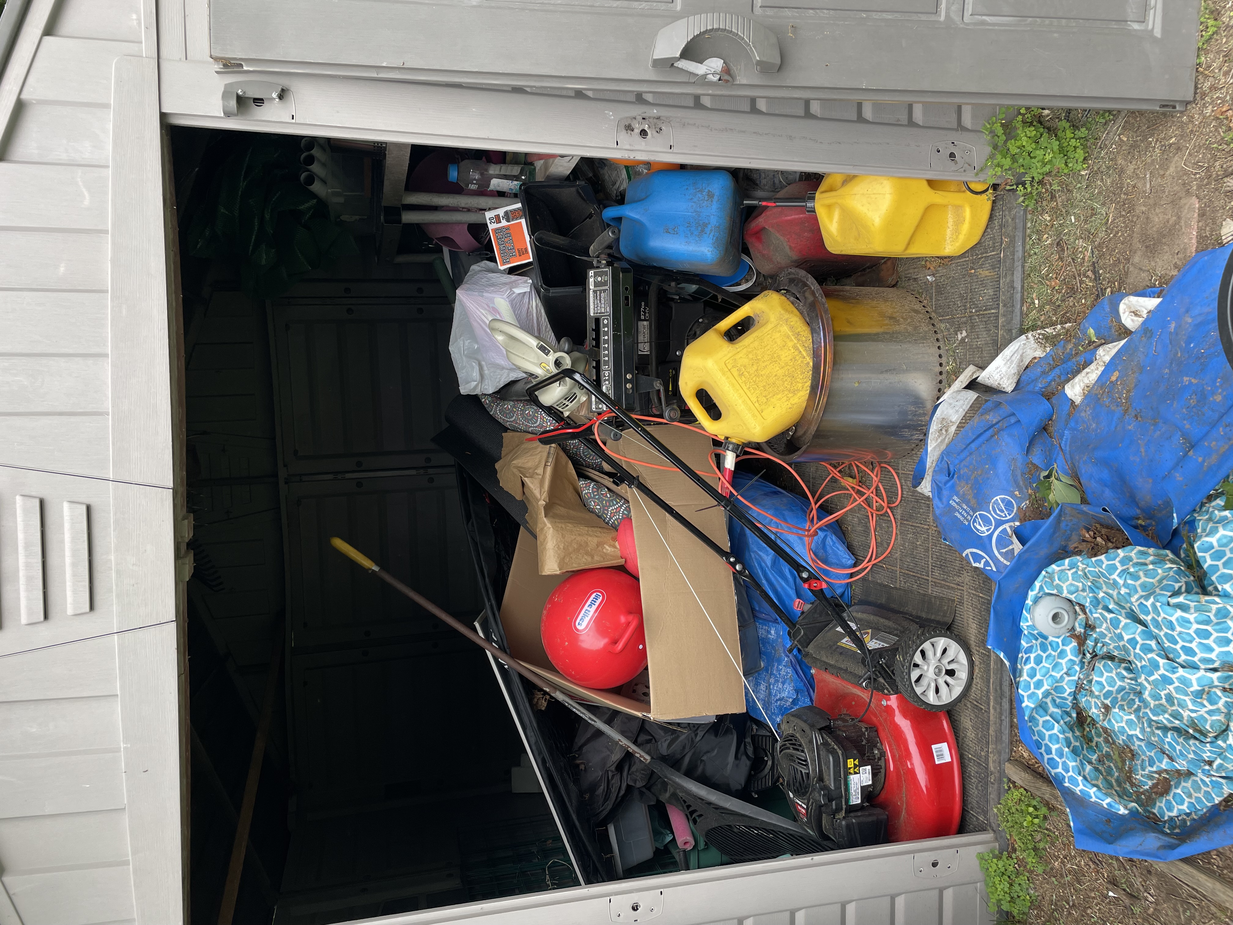 Cluttered shed before junk removal