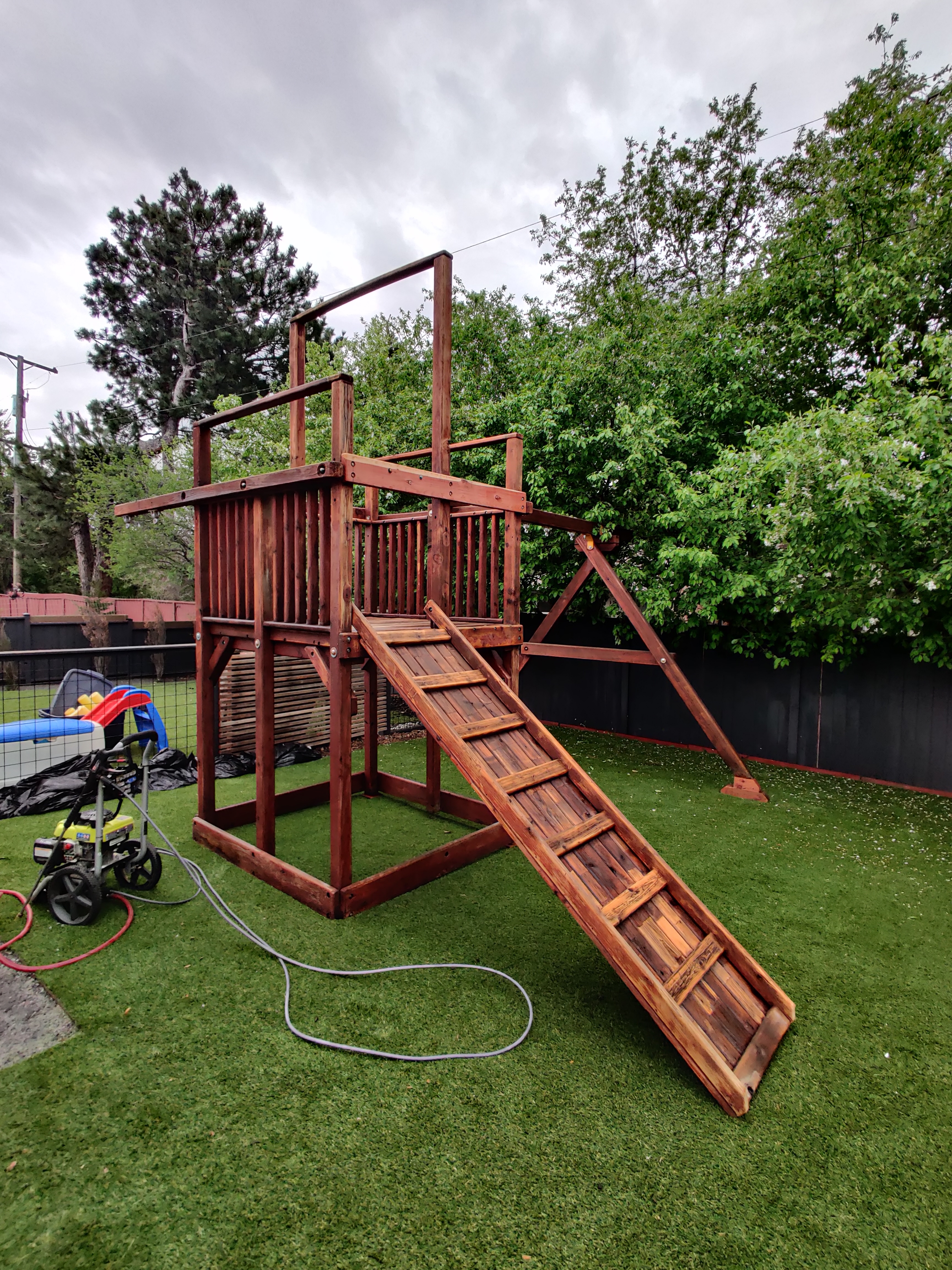 Outdoor structure — playhouse assembly and staining