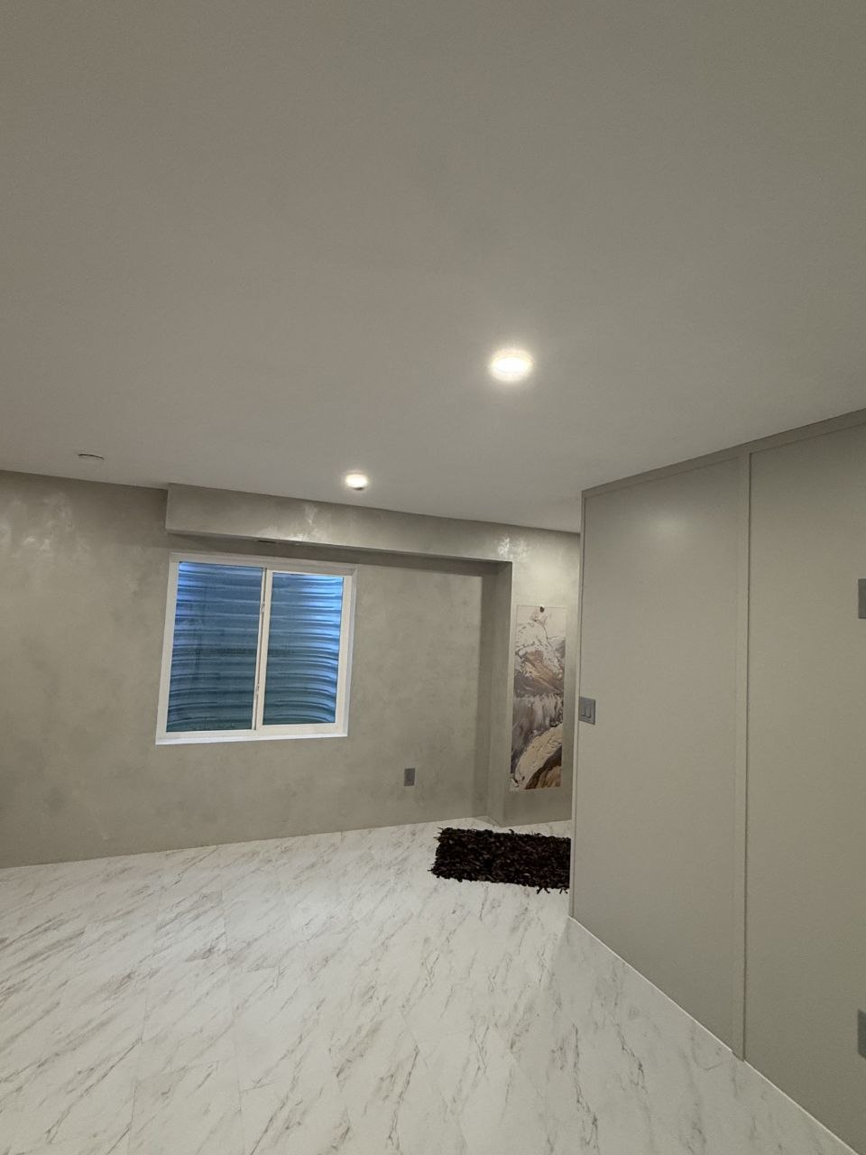 Finished room with new flooring and painted walls