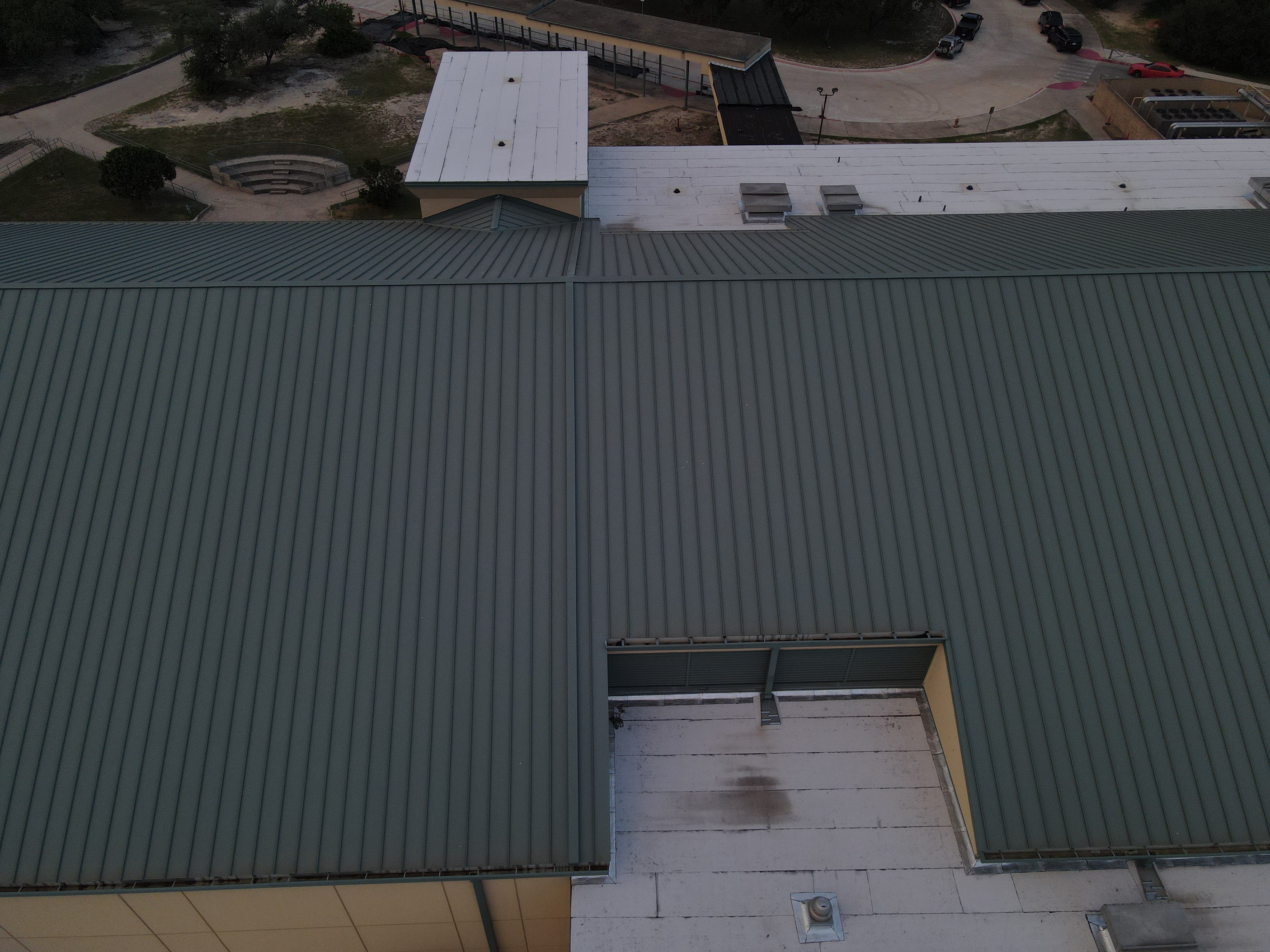 San Antonio industrial complex multi-roof drone inspection standing seam metal roof TPO sections commercial facility aerial monitoring Central Texas