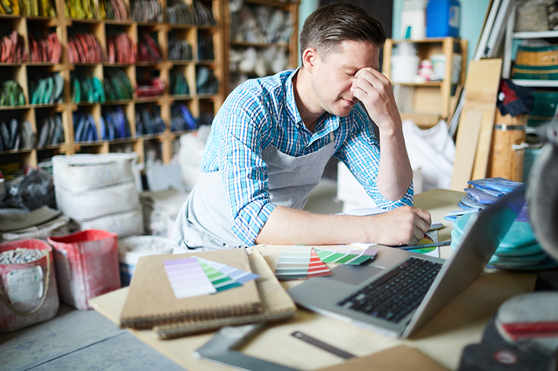 Frustrated business owner overwhelmed by marketing decisions