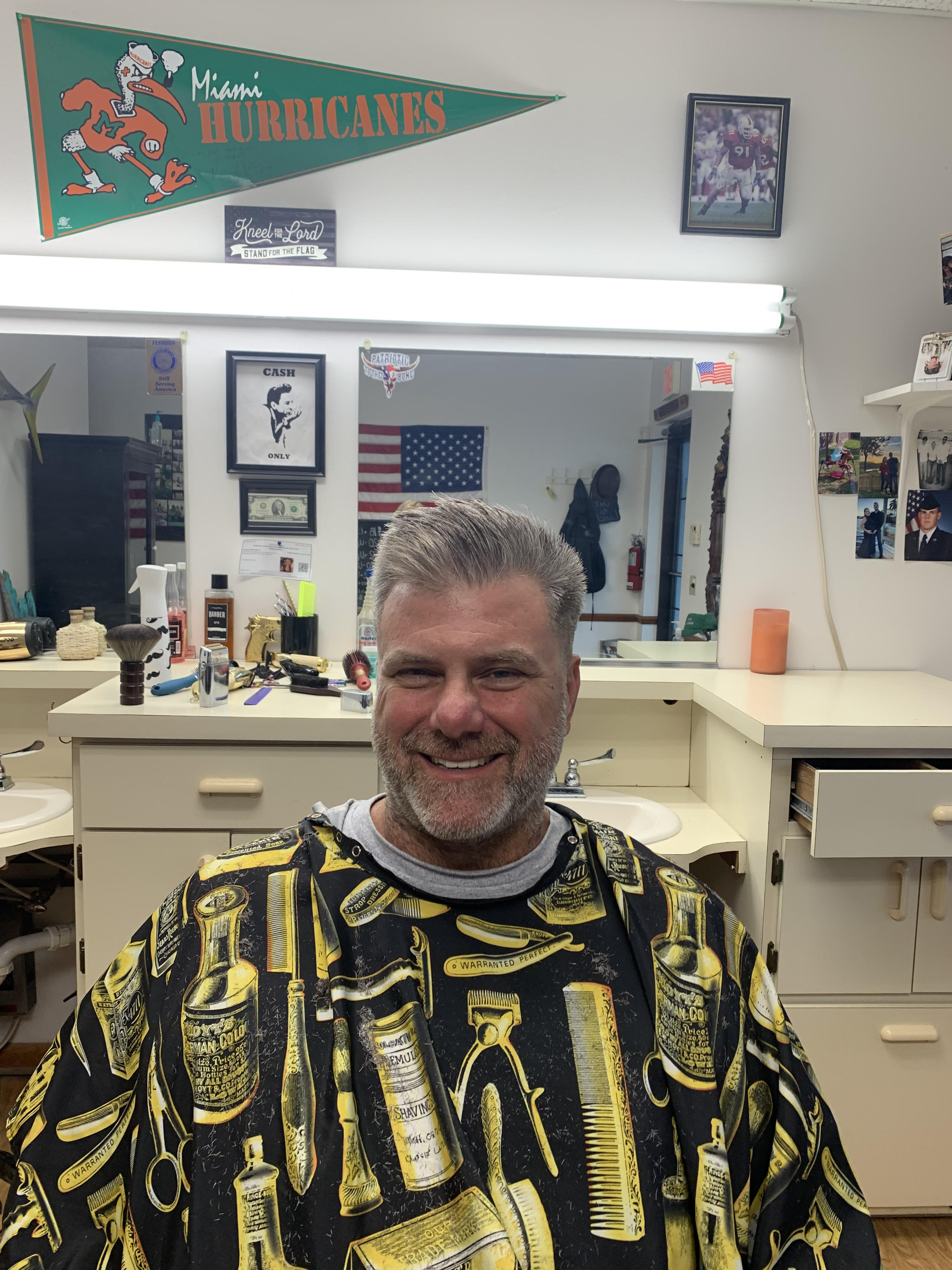 Franks Family Barbershop American flag and waiting area