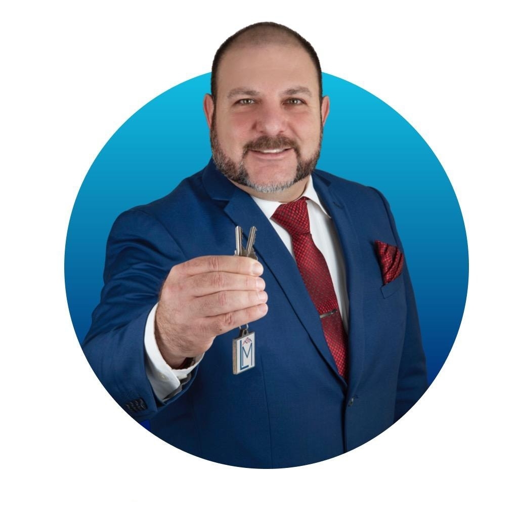 Lorenzo Martinez, licensed real estate broker in Bakersfield, CA holding house keys