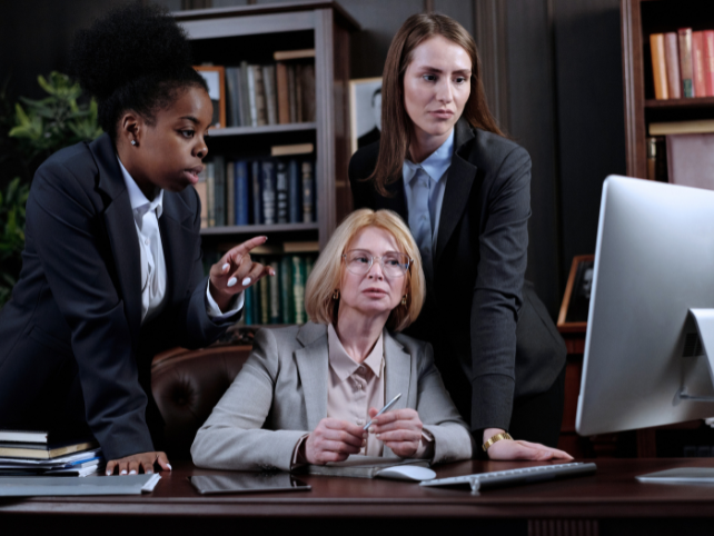 Legal professionals working with IT technology