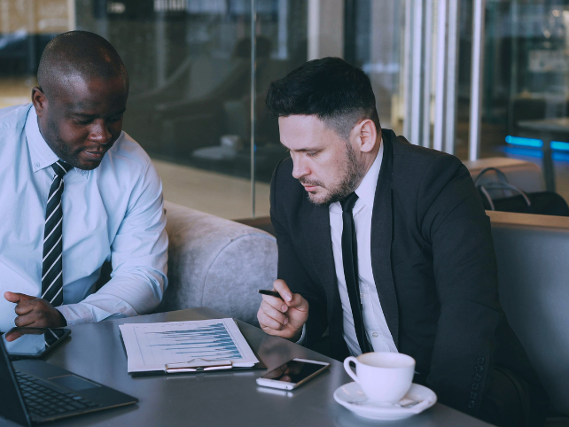 Financial professionals reviewing data in a modern office