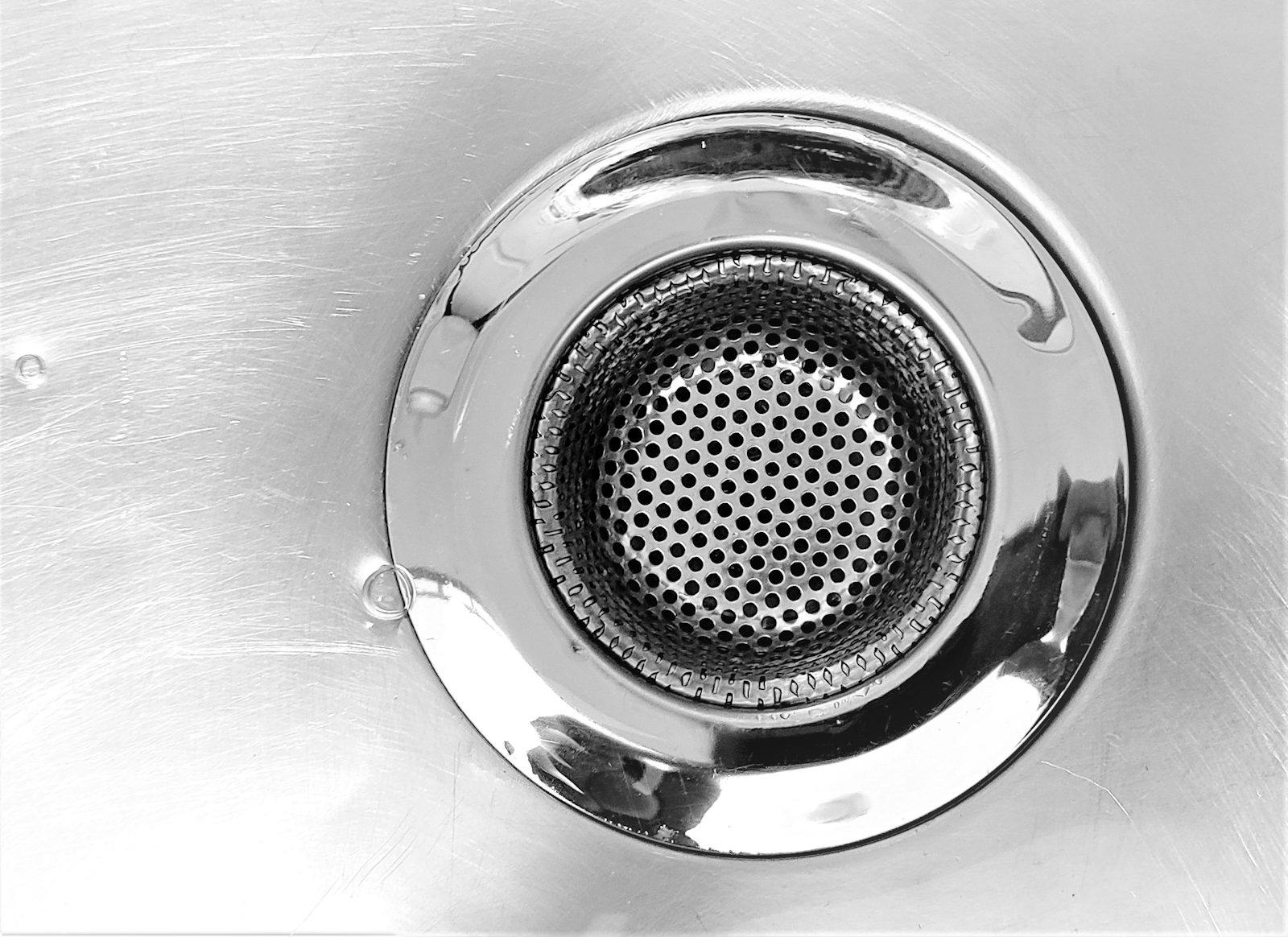 Close up of a metal sink drain