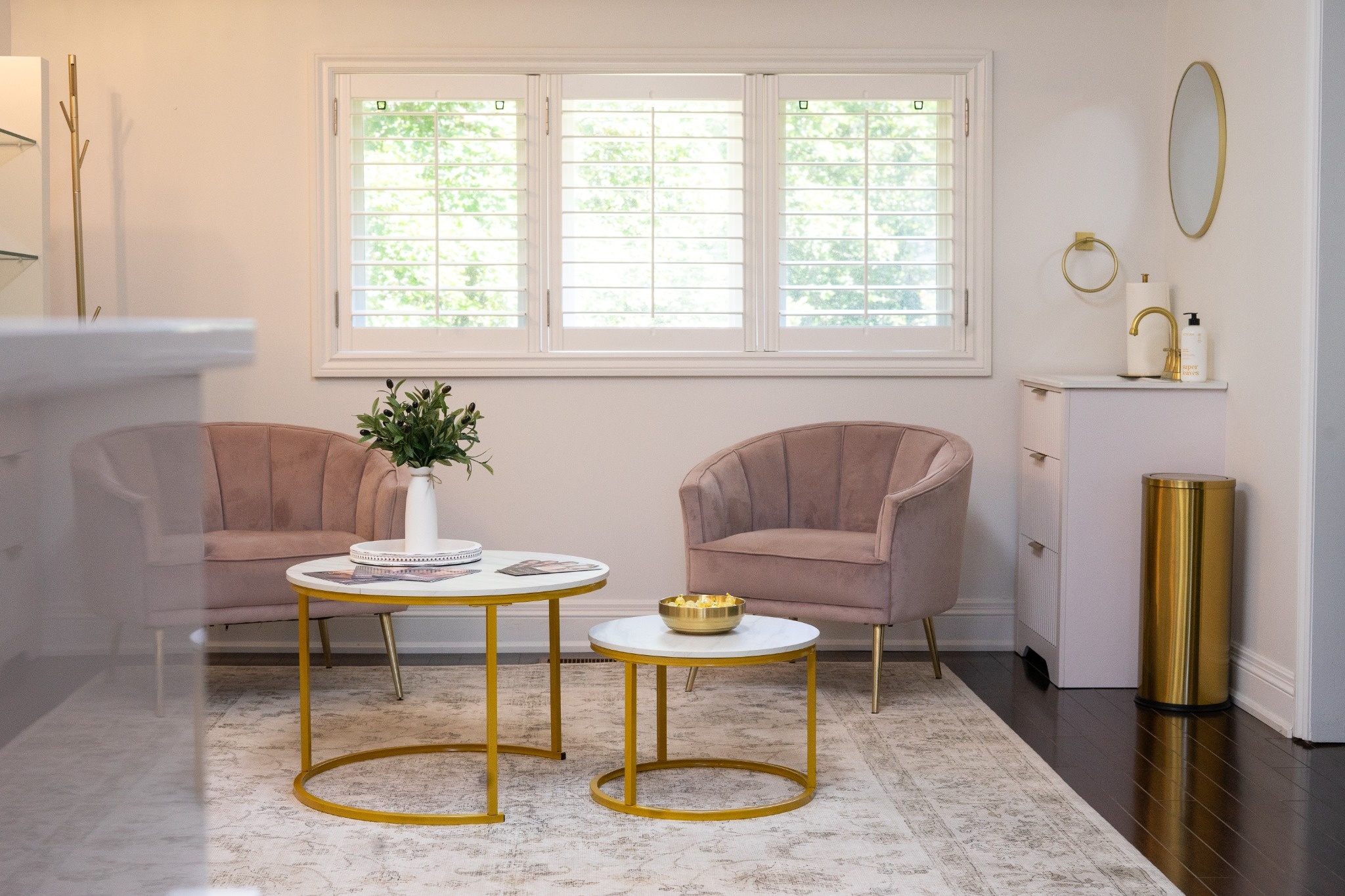 Brilliance Medical Aesthetics waiting lounge with blush chairs and gold tables in Whitby