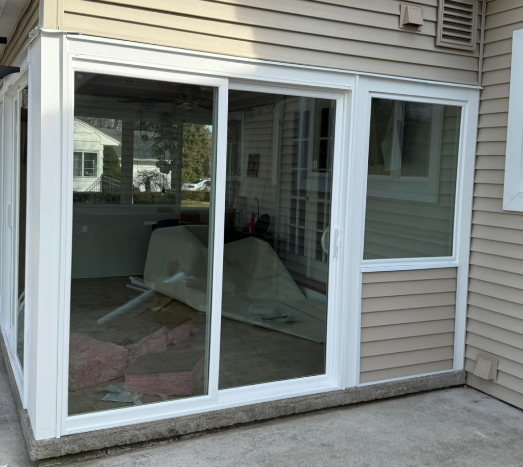 Brand new sliding glass door installation in Rochester NY home by Chase Impressions