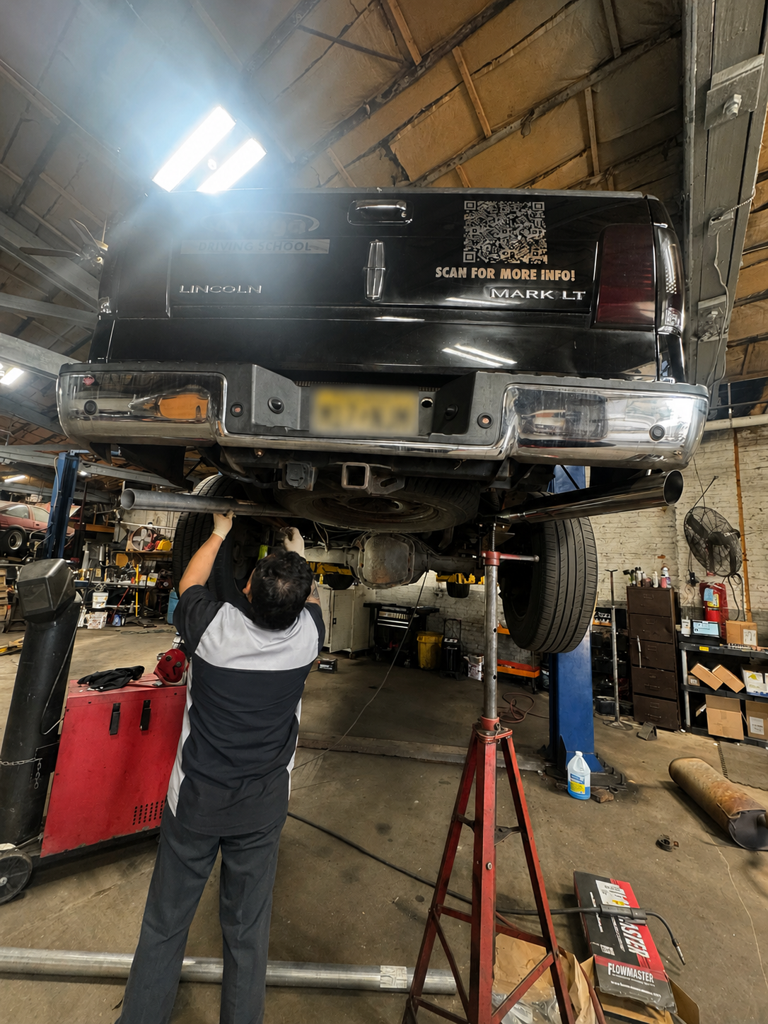 Mechanic inspecting engine