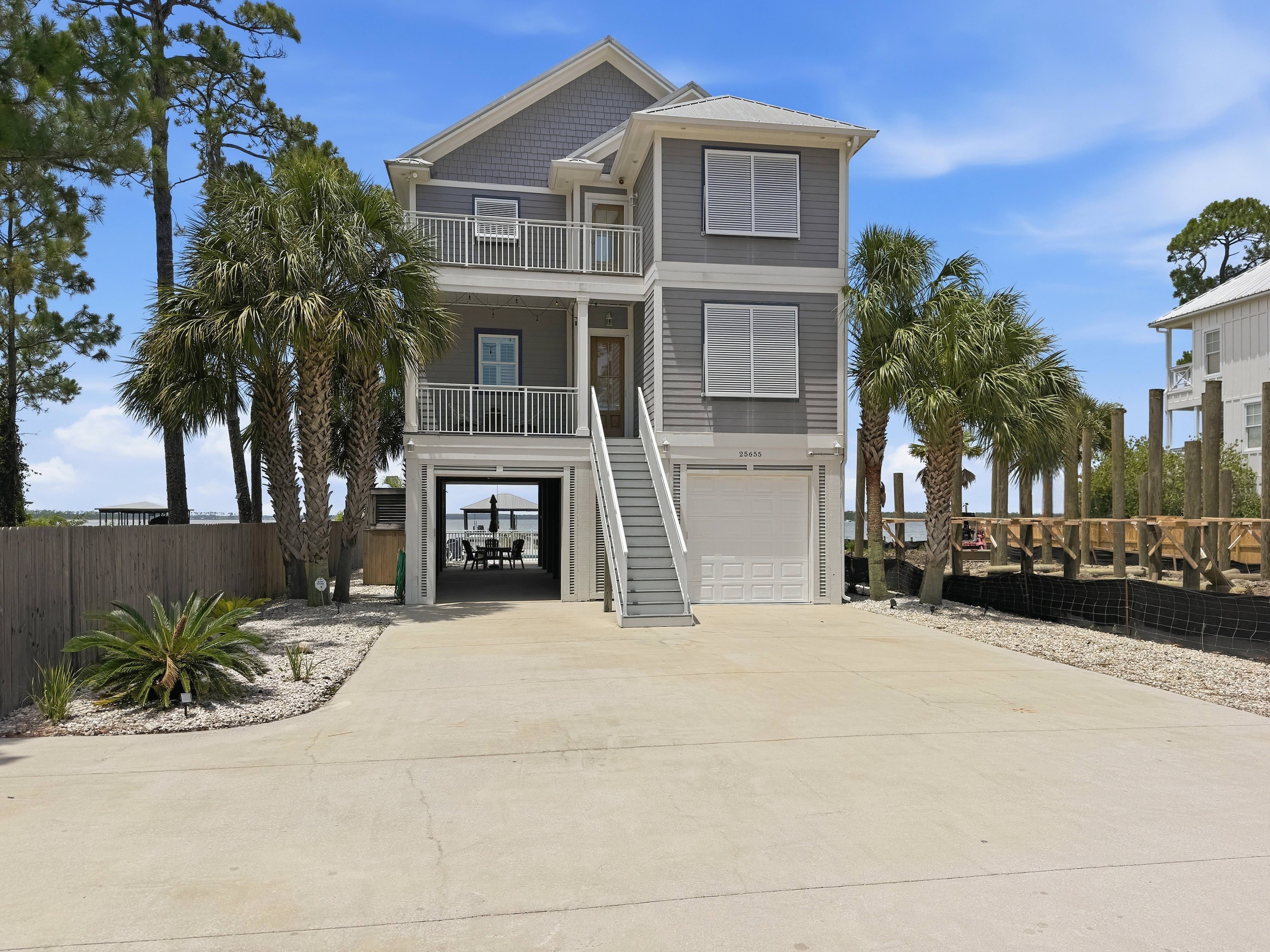 Front exterior of the coastal home at 25655 West Perdido Key Drive